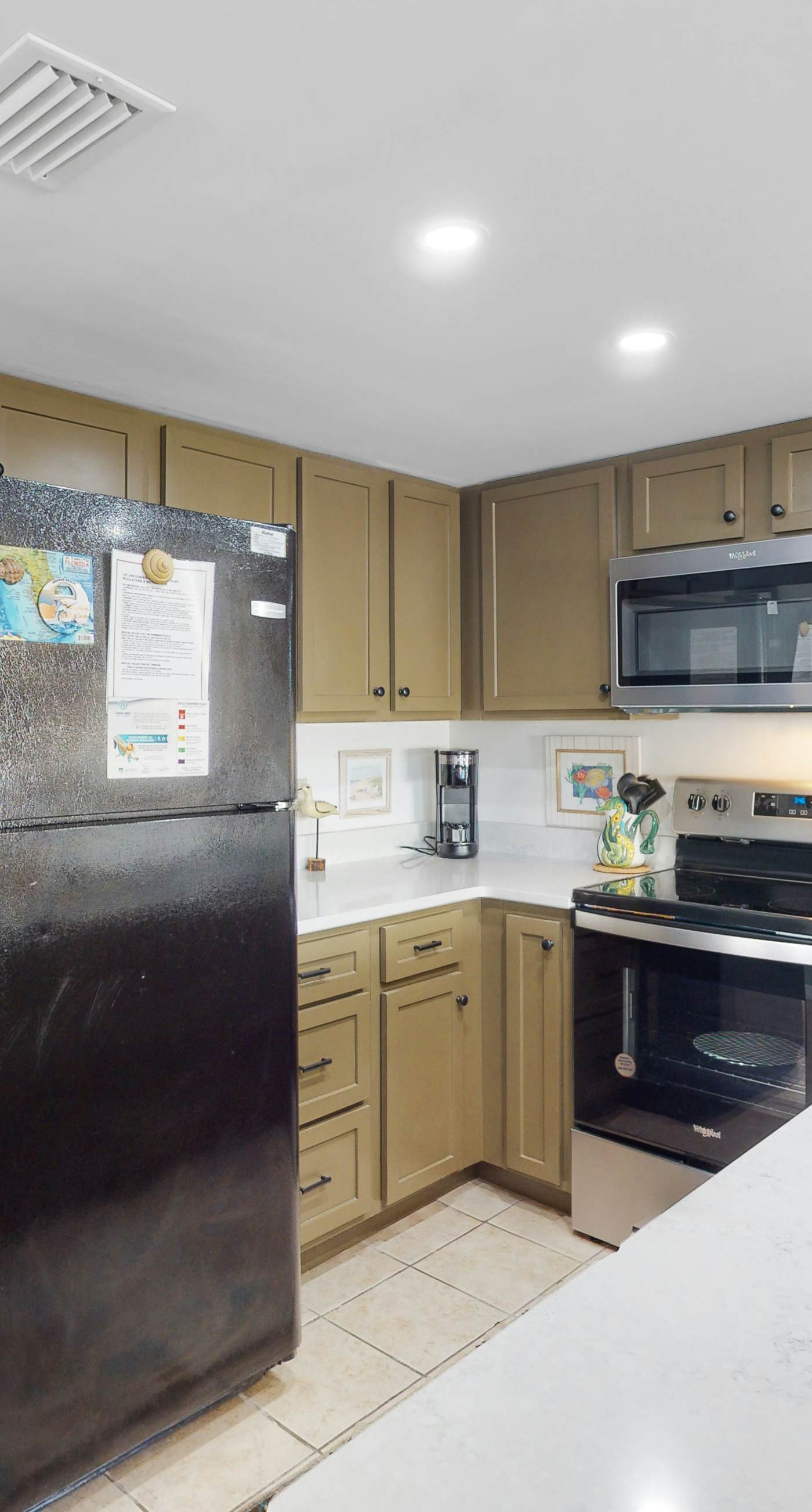 Riverside condo with pool, covered balcony, & easy beach access