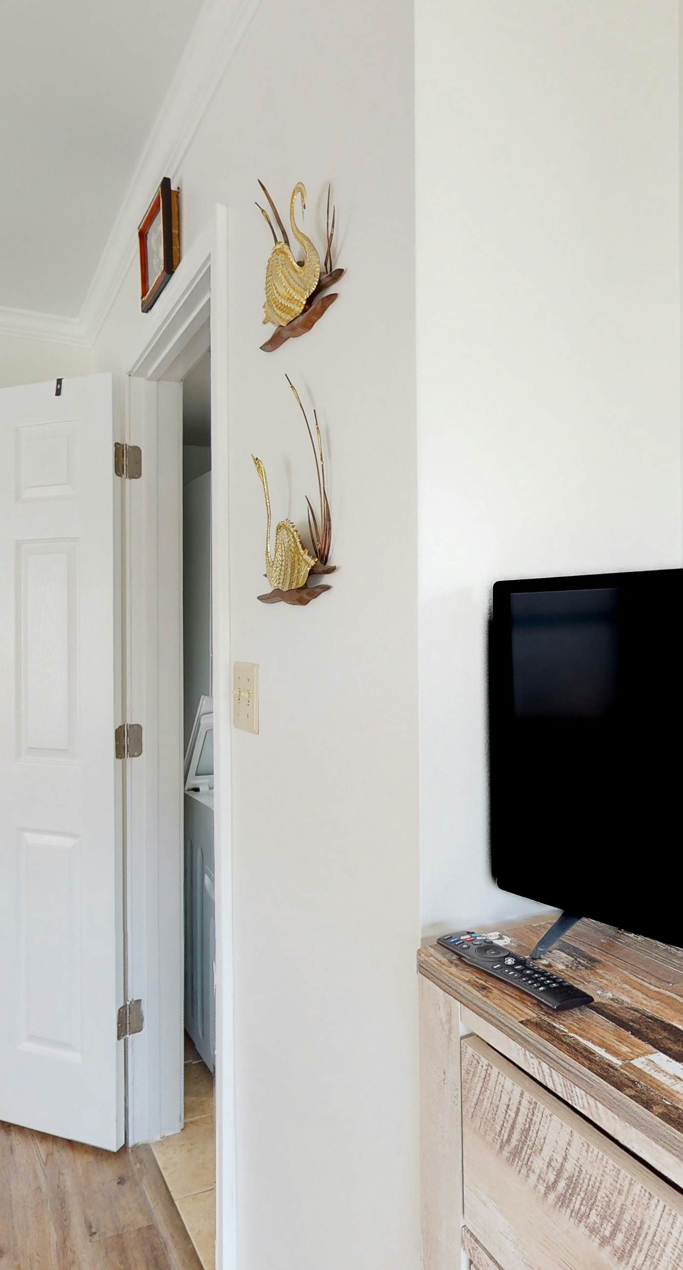 Riverside condo with pool, covered balcony, & easy beach access