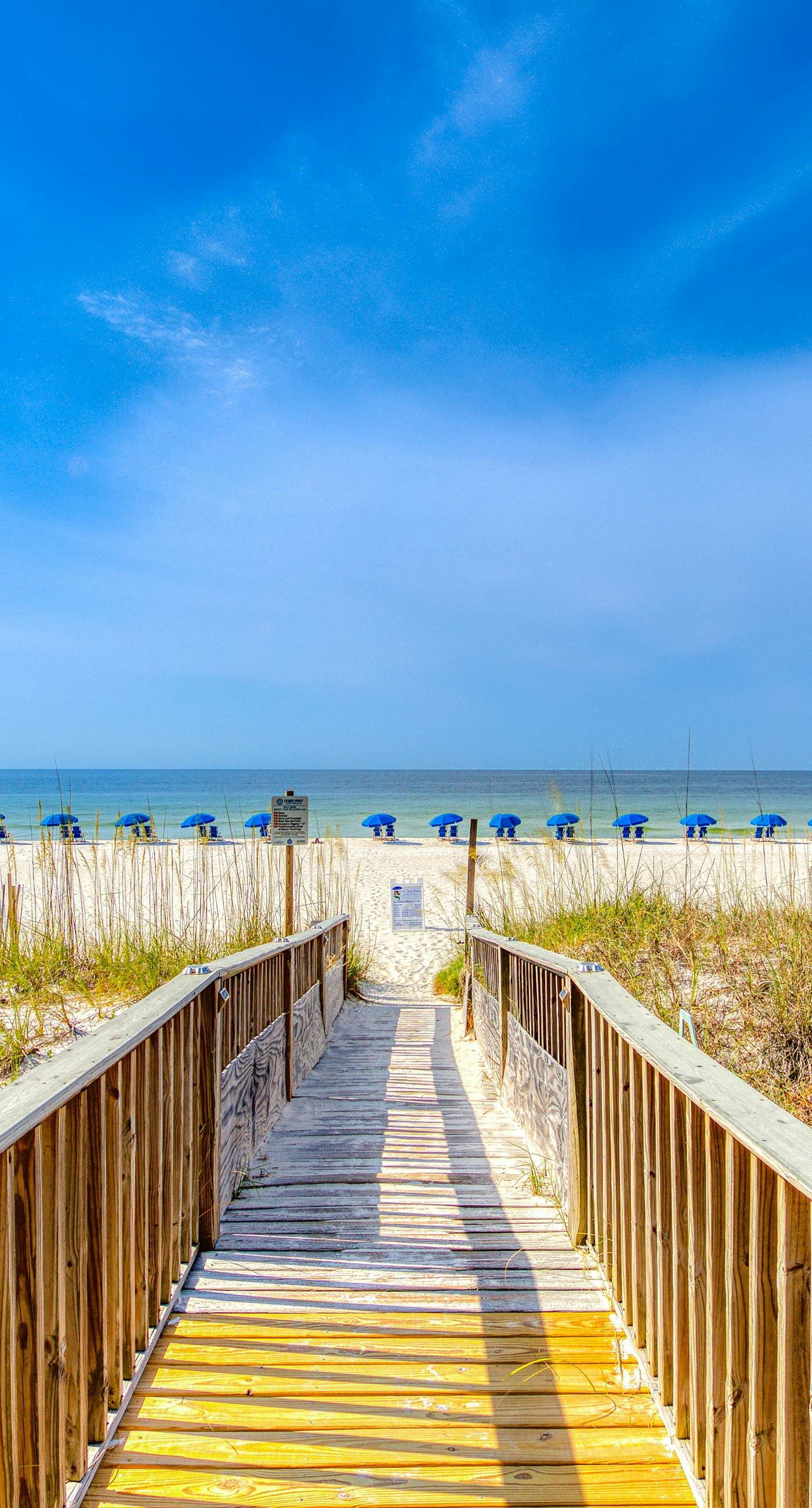 Riverside condo with pool, covered balcony, & easy beach access