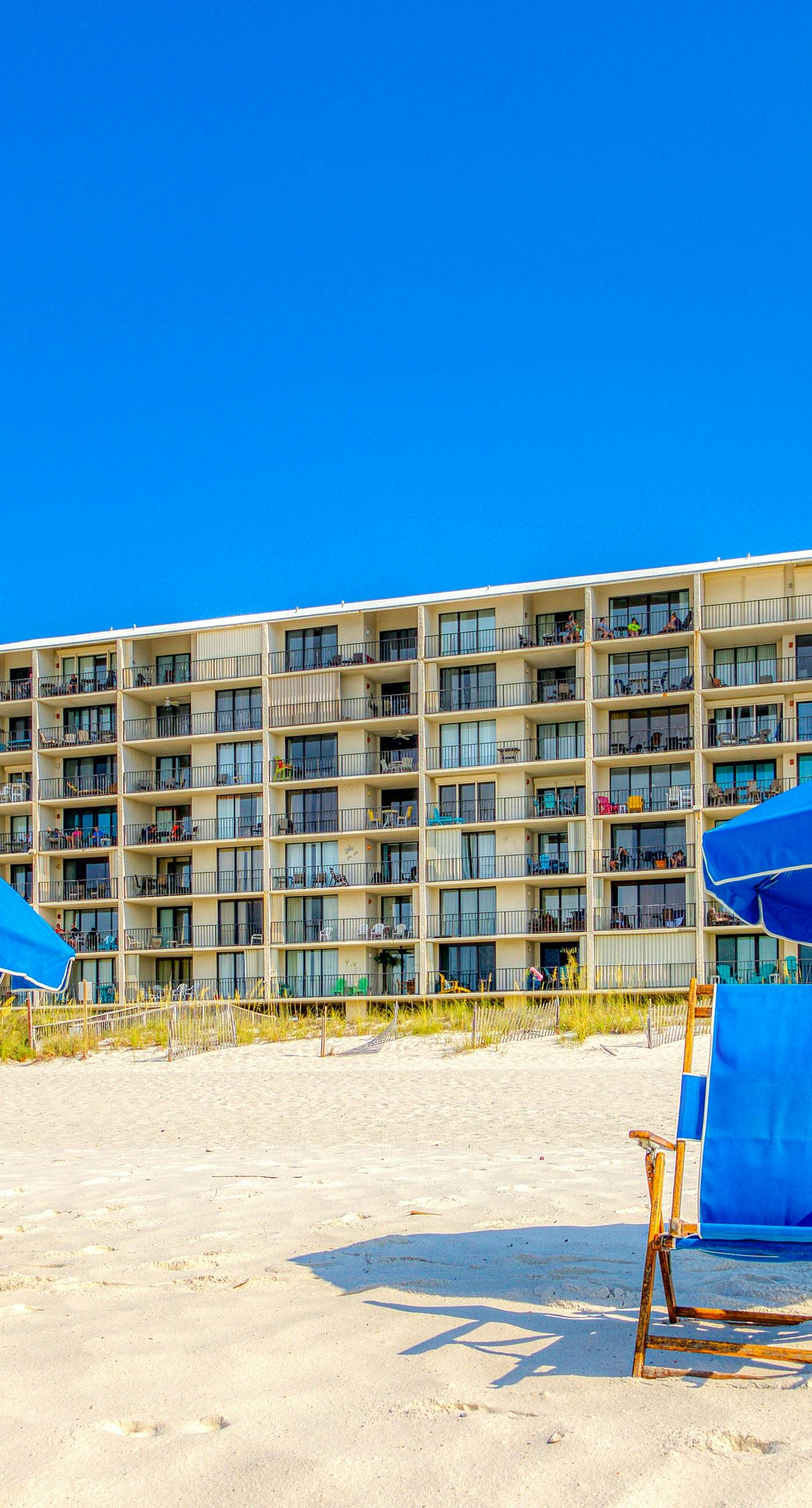 Riverside condo with pool, covered balcony, & easy beach access