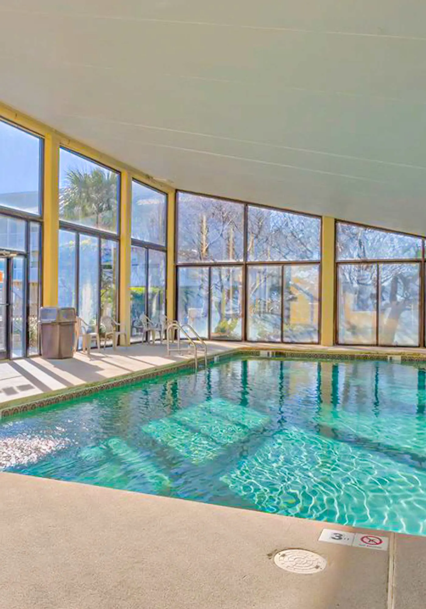 Serene water view condo with pools, sauna, tennis court, fitness center, W&D