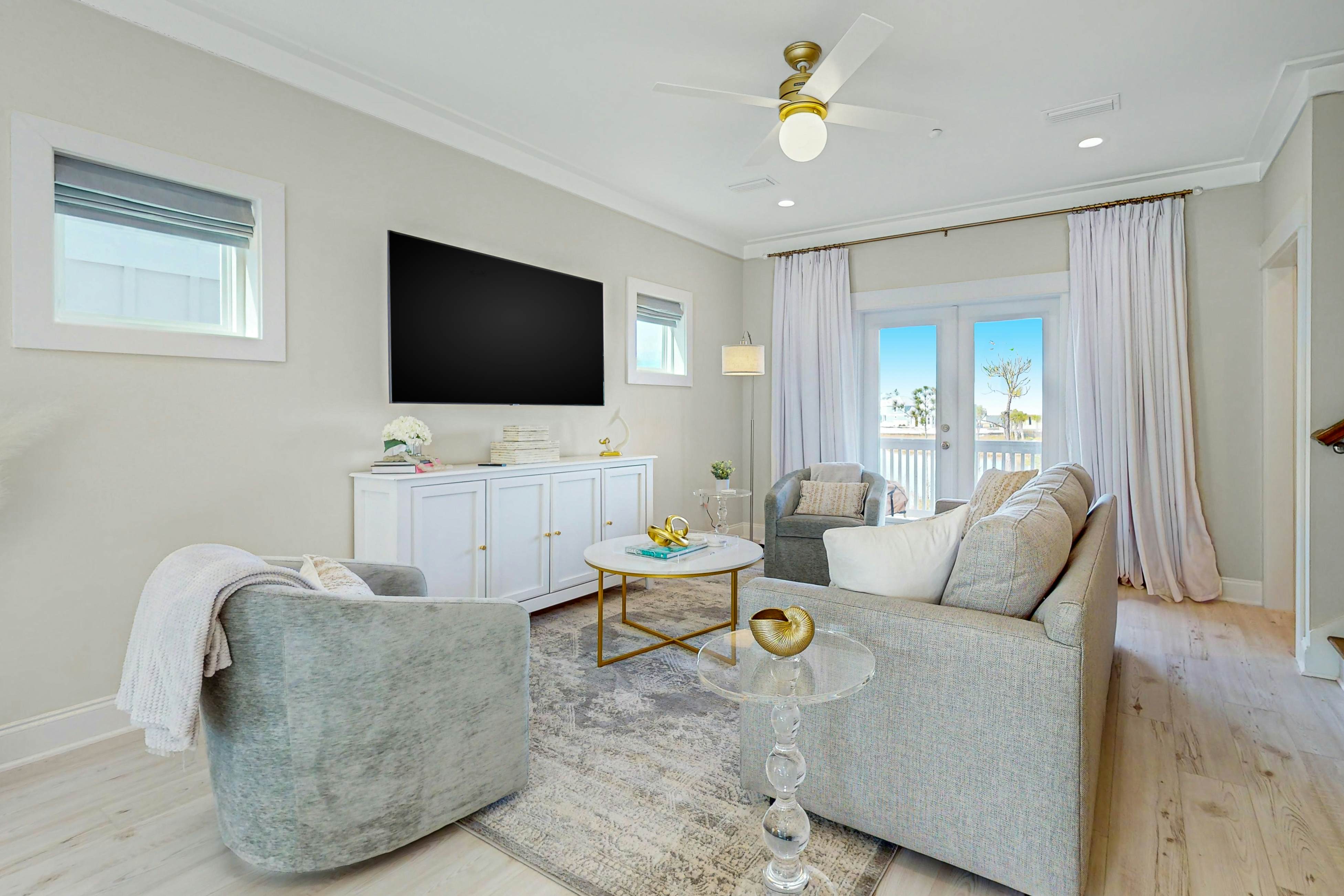 Modern coastal home with great outdoor space, open layout, smart TVs, & games