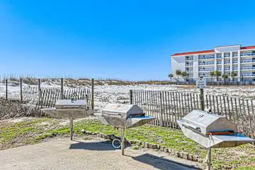Gulf front condo with onsite snack bar, three shared pools, and internet