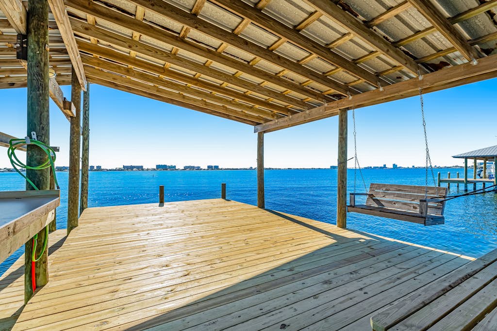 Charming bay front home with WiFi, central AC, balcony, & deck