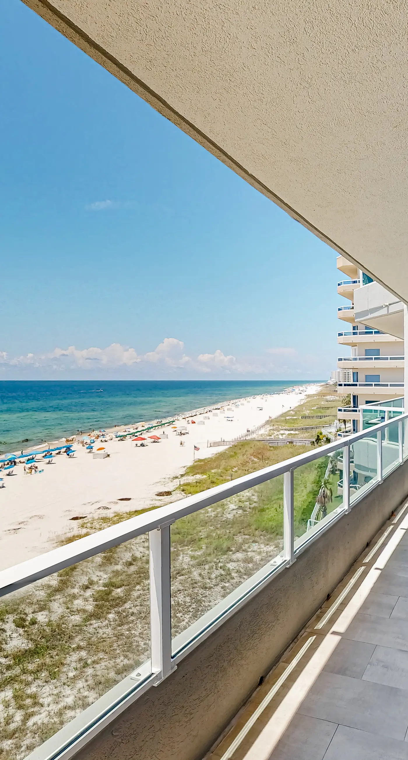 Beachfront corner condo with Gulf-view balcony, pool & beach access