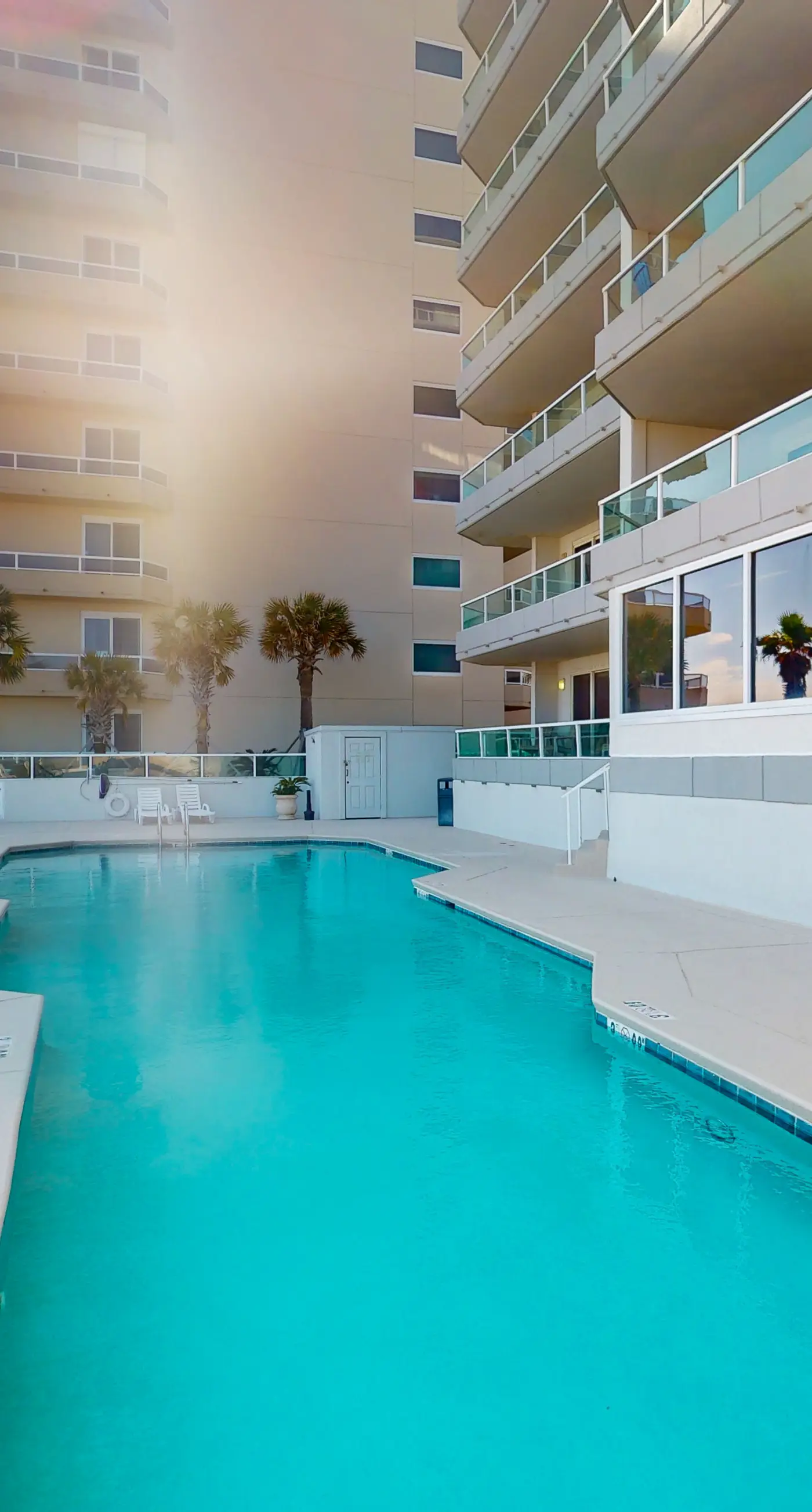 Beachfront corner condo with Gulf-view balcony, pool & beach access