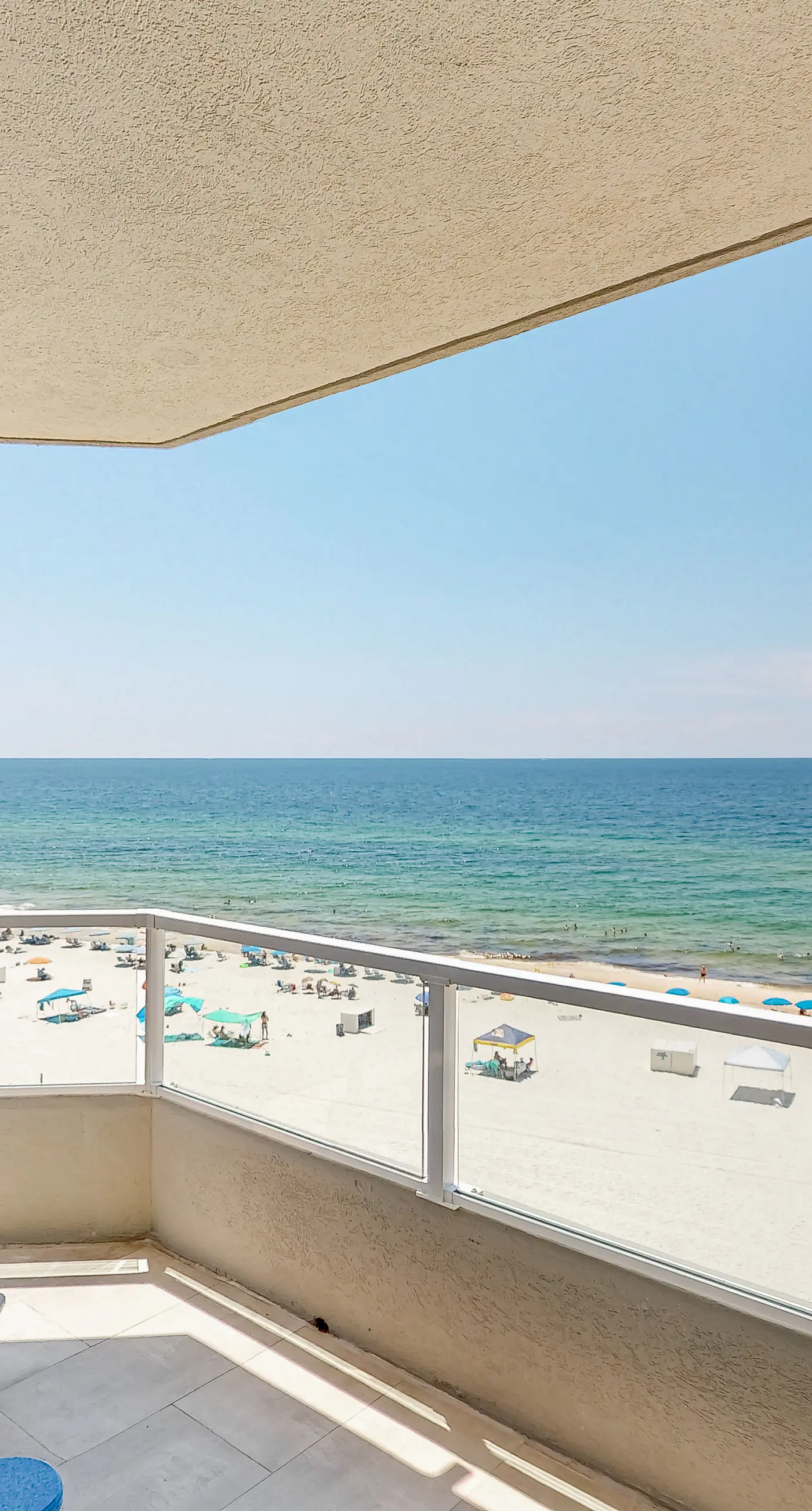 Beachfront corner condo with Gulf-view balcony, pool & beach access