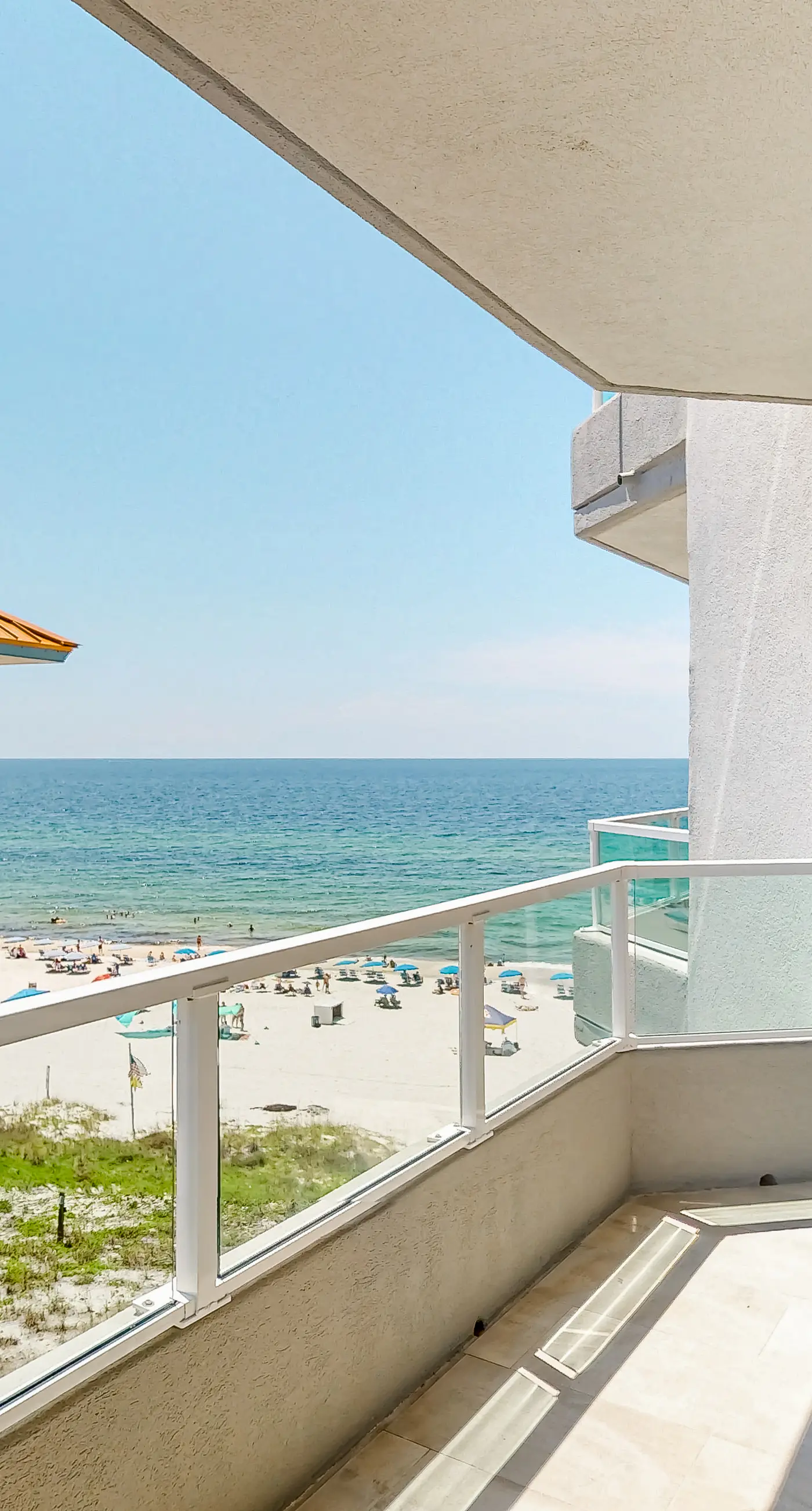Beachfront corner condo with Gulf-view balcony, pool & beach access