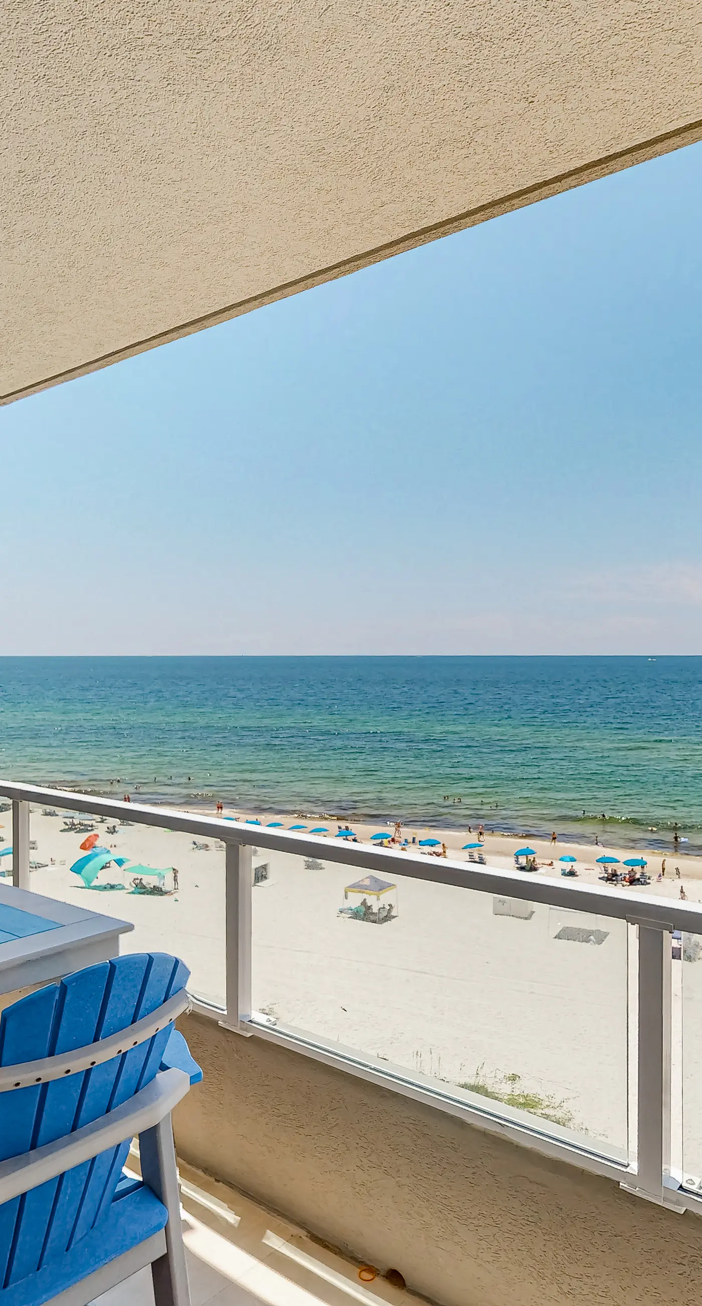Beachfront corner condo with Gulf-view balcony, pool & beach access