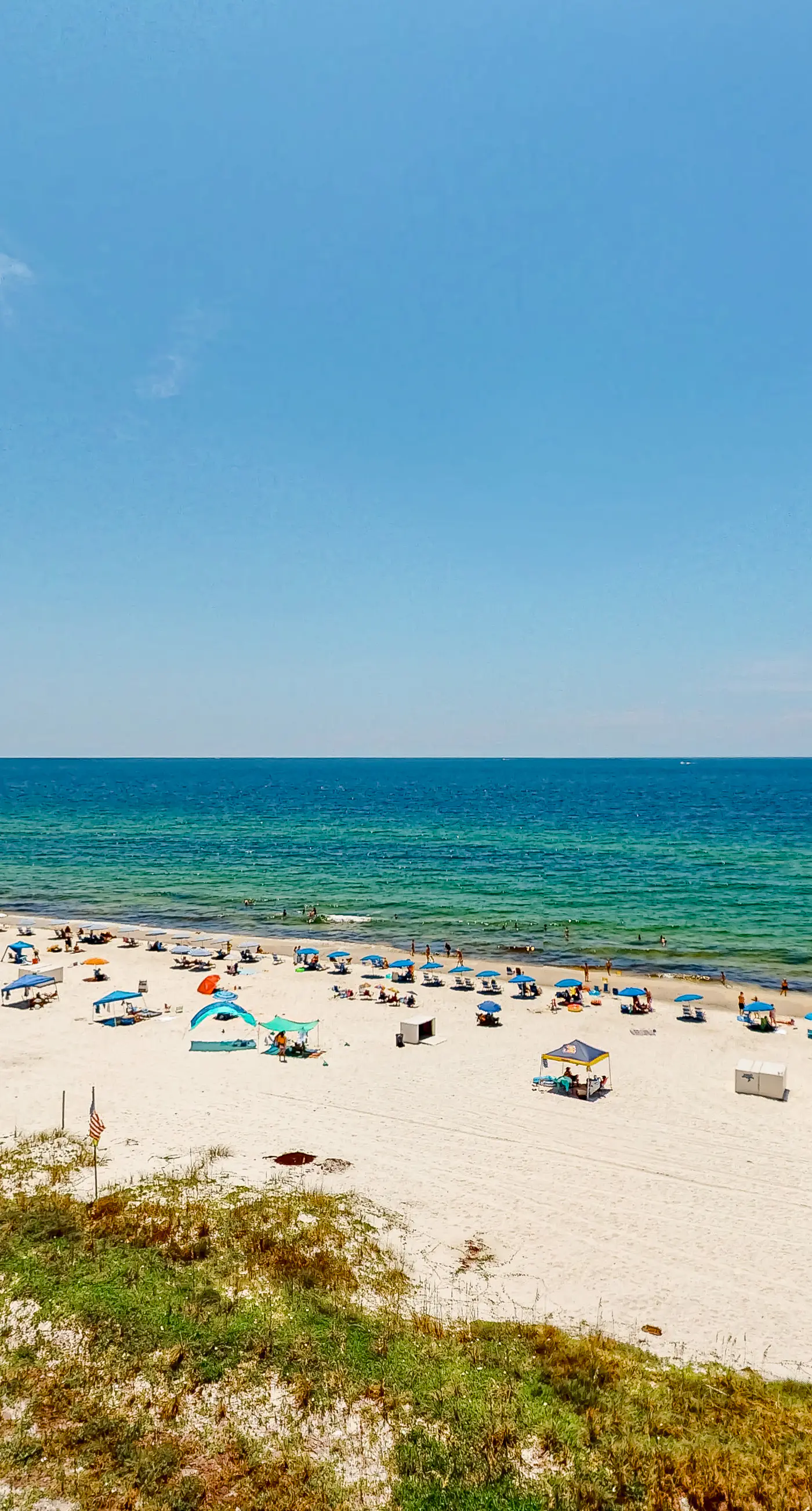 Beachfront corner condo with Gulf-view balcony, pool & beach access