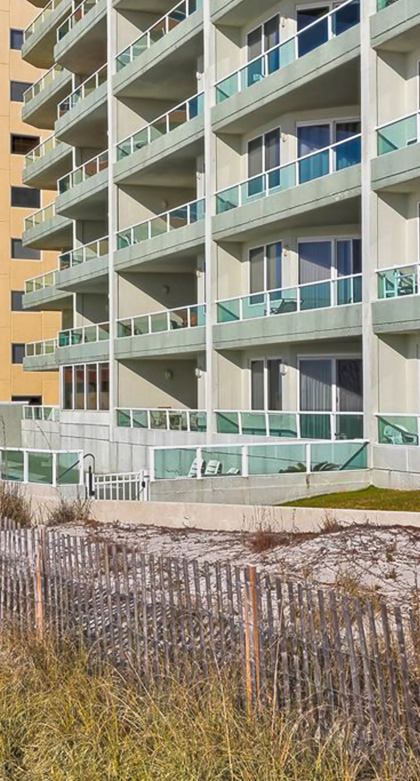 Beachfront corner condo with Gulf-view balcony, pool & beach access