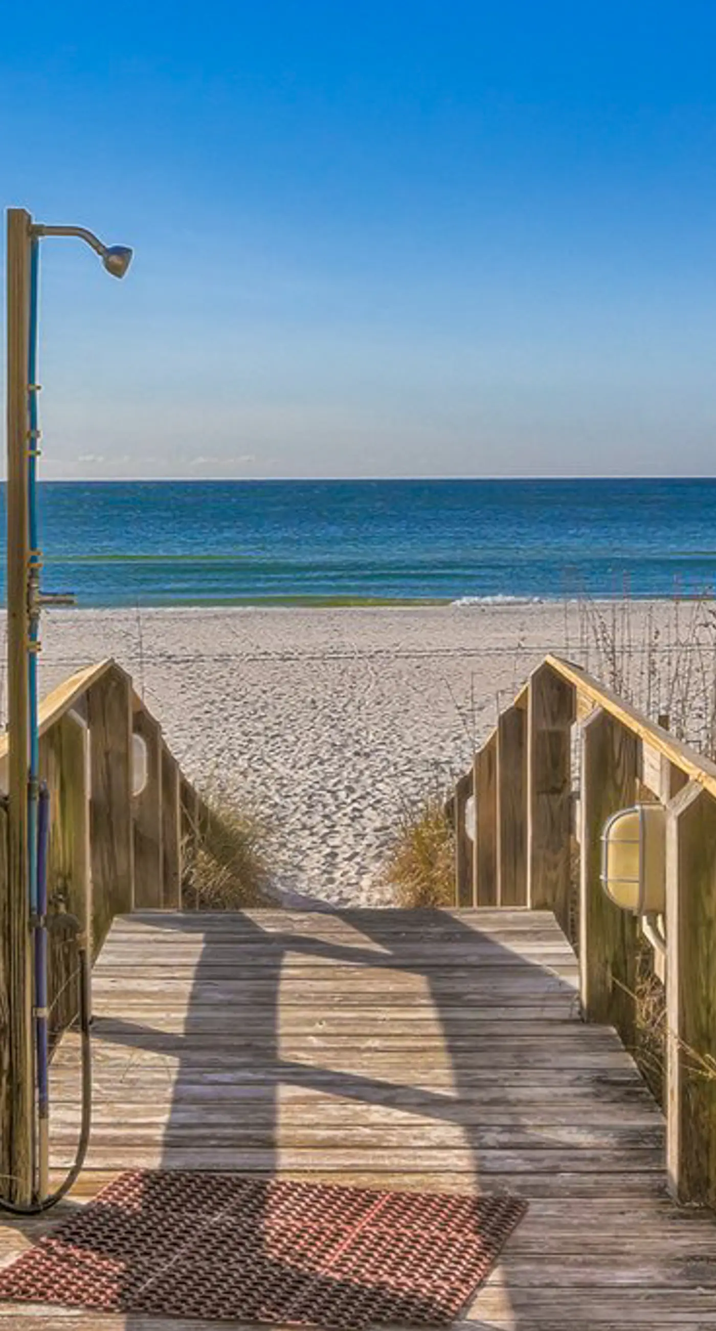 Beachfront corner condo with Gulf-view balcony, pool & beach access