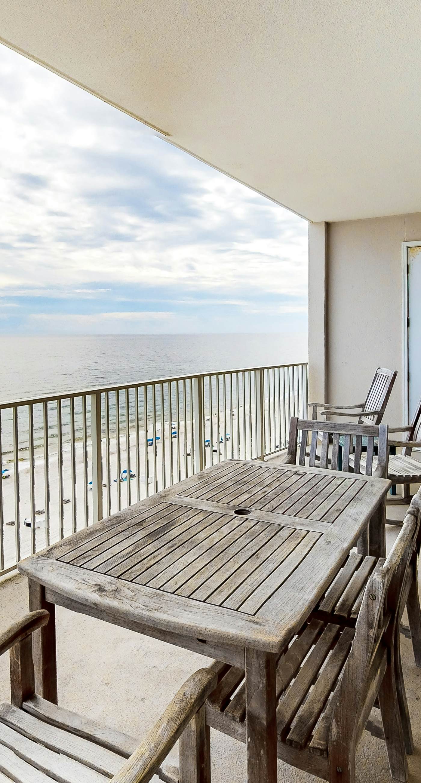 Beachfront condo with Gulf view, balcony, pools, hot tubs & gym access