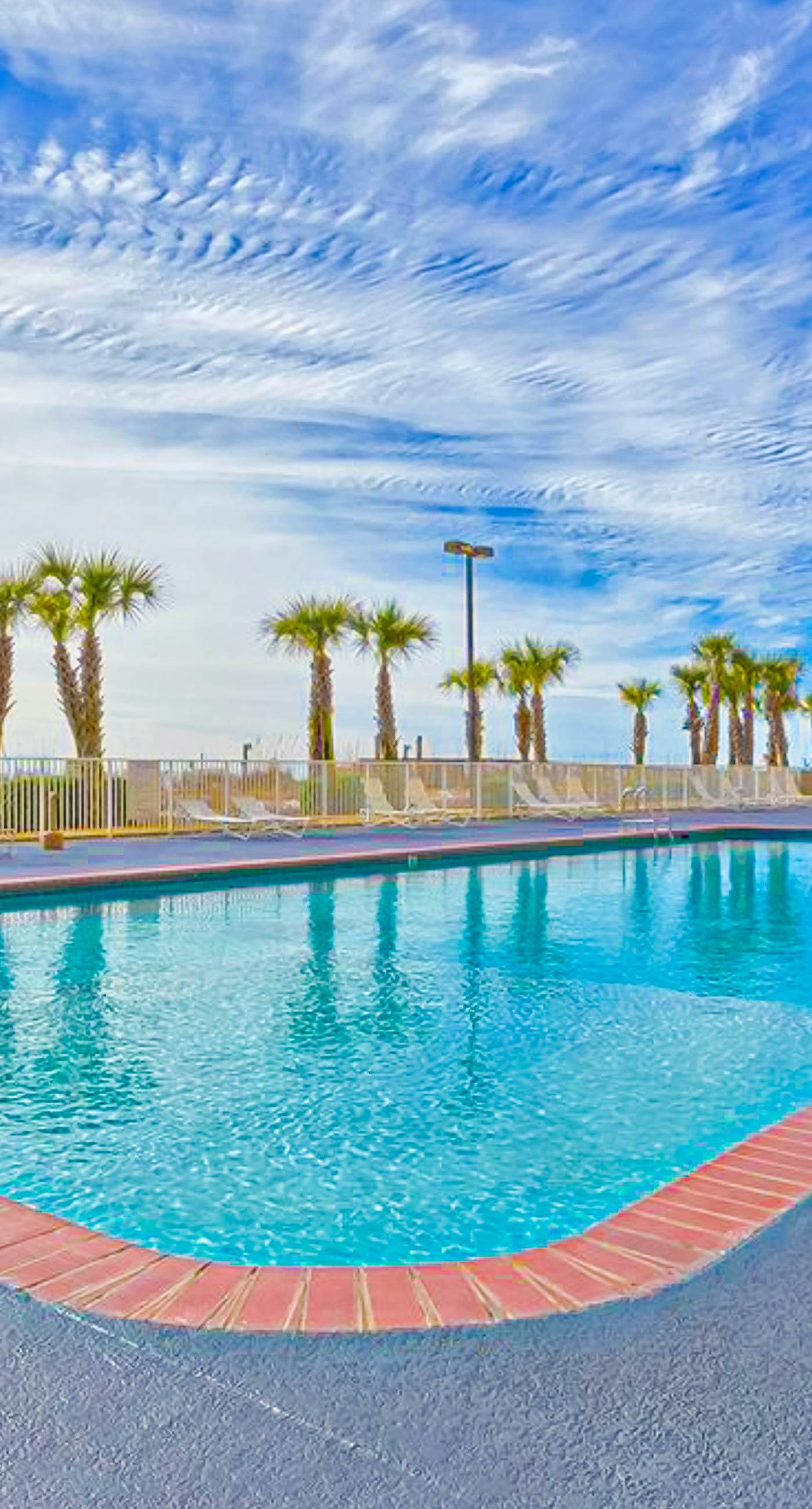 Beachfront condo with Gulf view, balcony, pools, hot tubs & gym access
