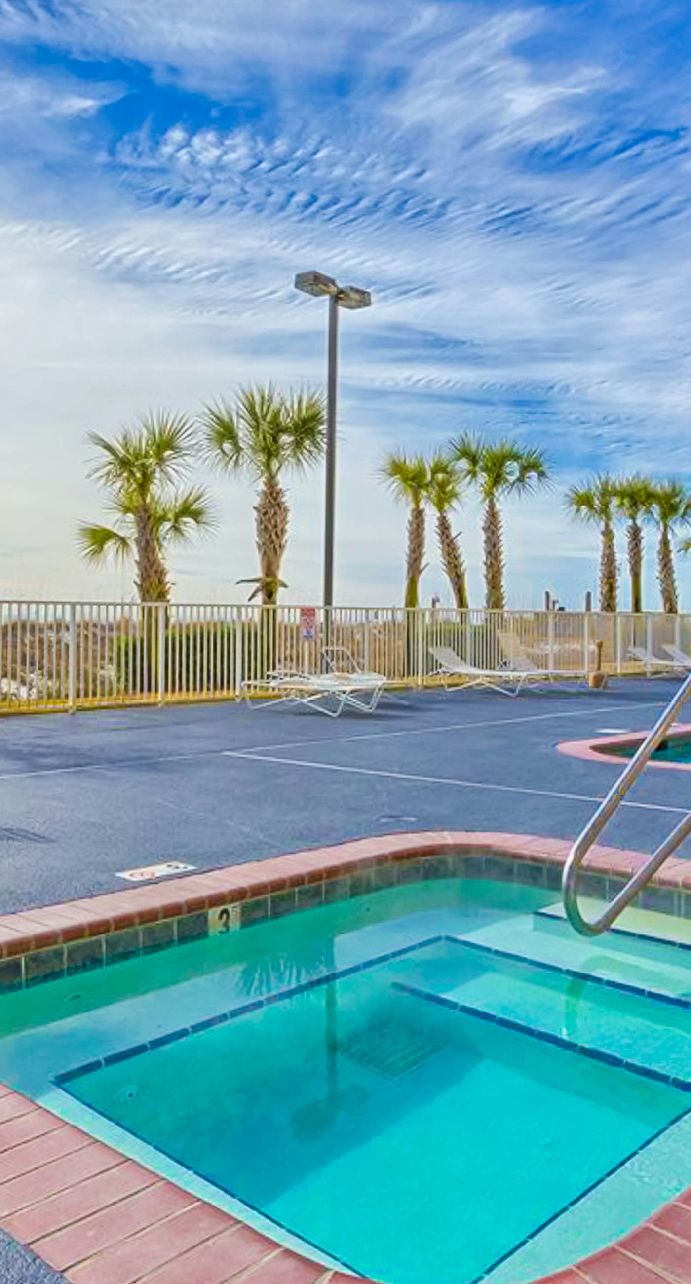 Beachfront condo with Gulf view, balcony, pools, hot tubs & gym access
