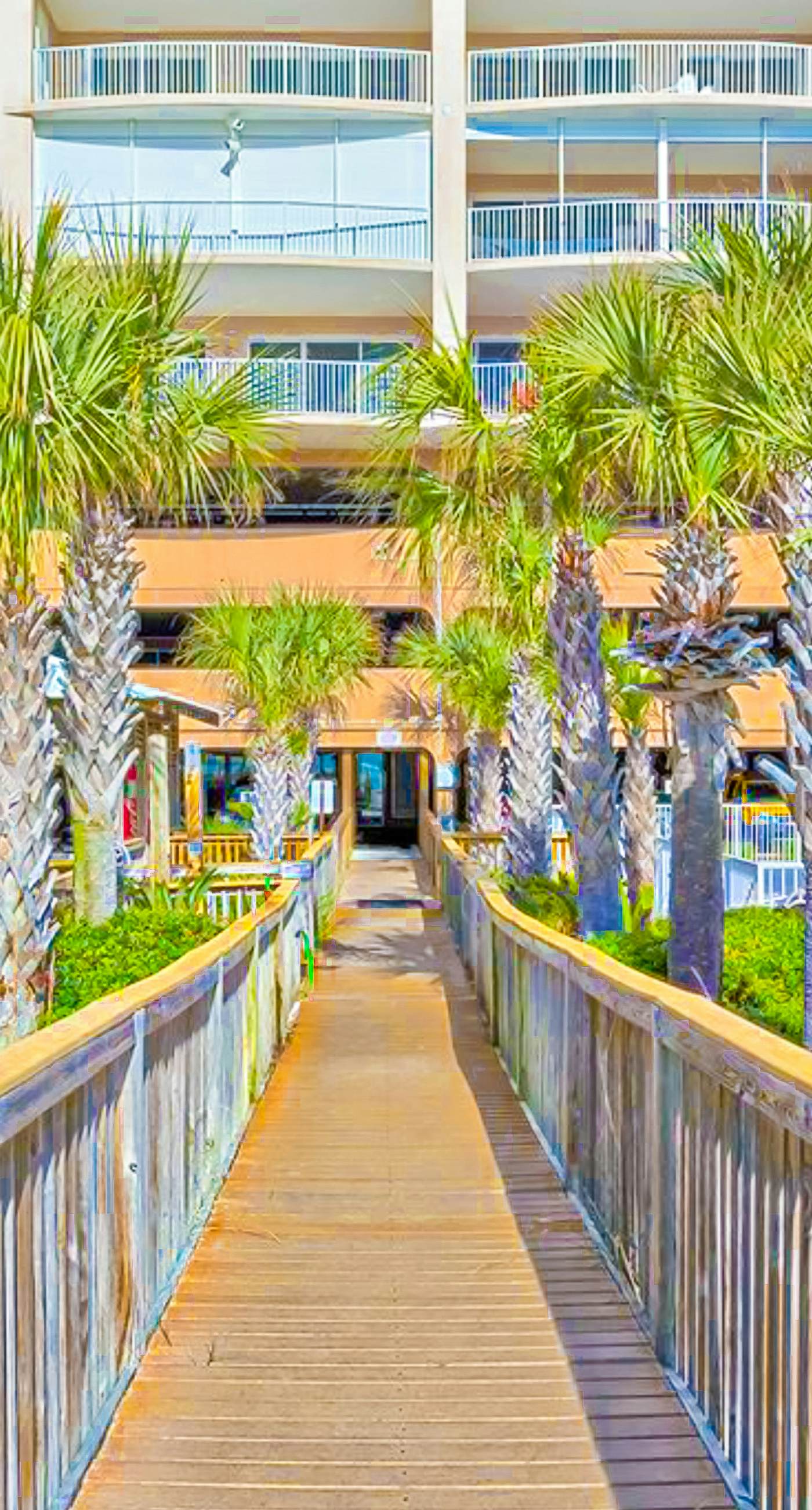 Beachfront condo with Gulf view, balcony, pools, hot tubs & gym access