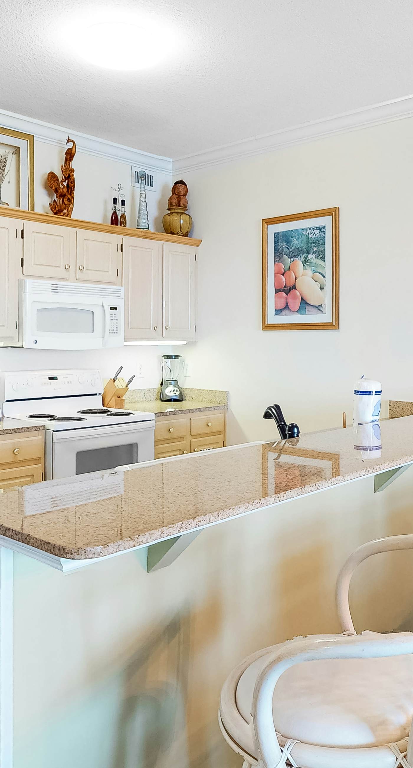 Gulf-front condo with shaded balcony, pools, hot tubs, gym & beach access