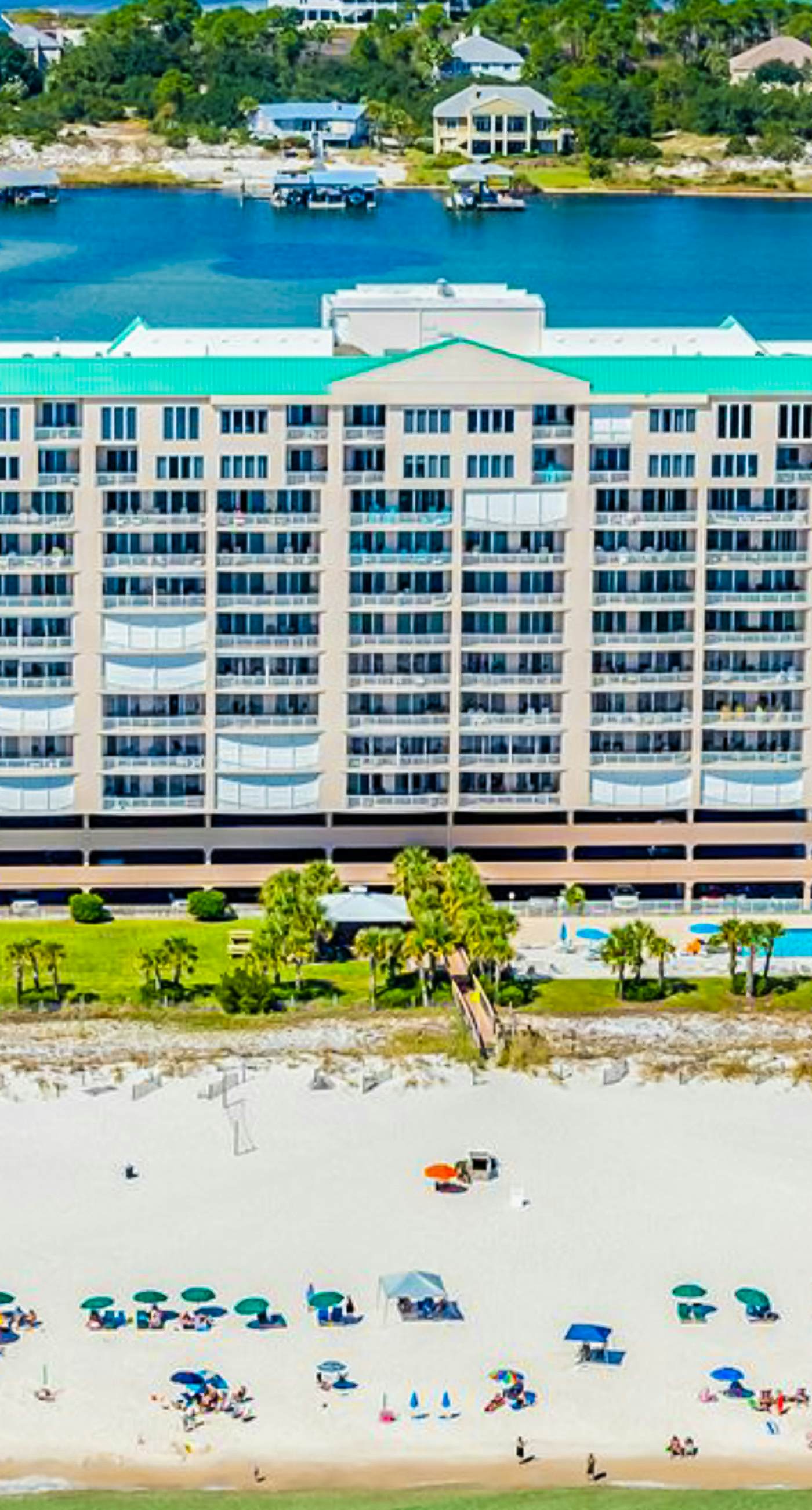 Gulf-front condo with shaded balcony, pools, hot tubs, gym & beach access