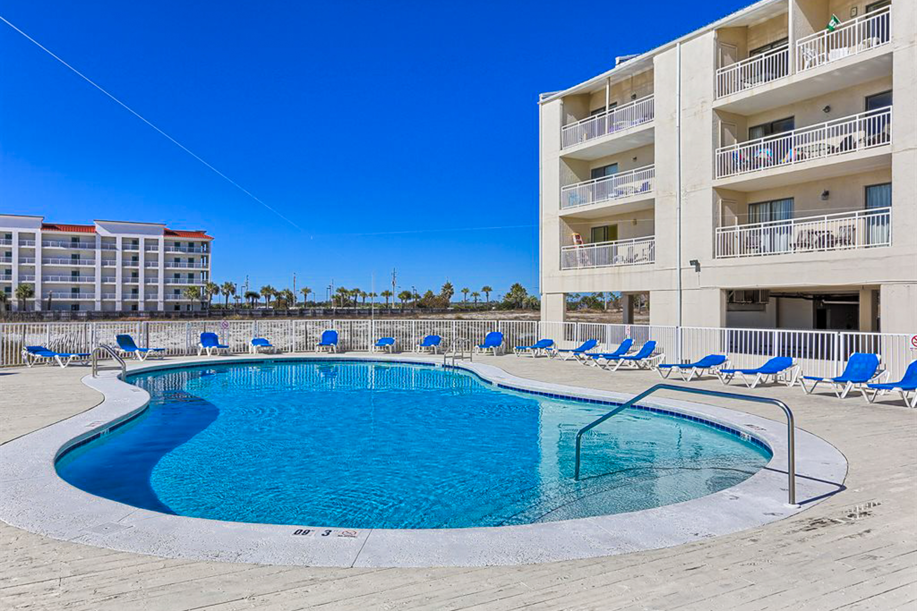 Bright resort condo with pool access, cozy patio, plus a washer/dryer