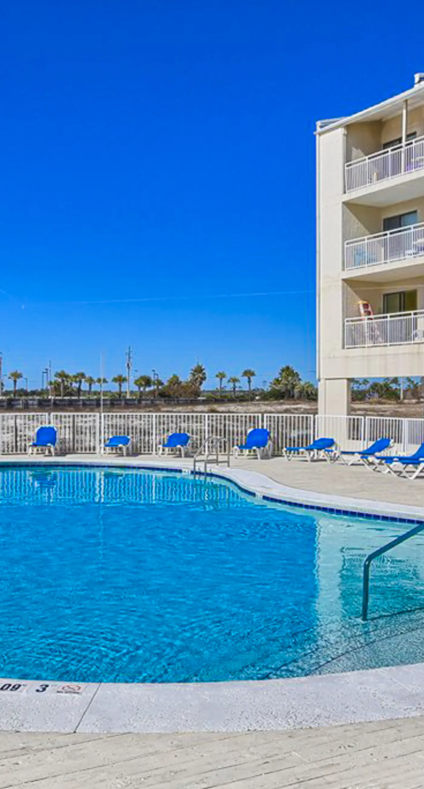 Bright resort condo with pool access, cozy patio, plus a washer/dryer