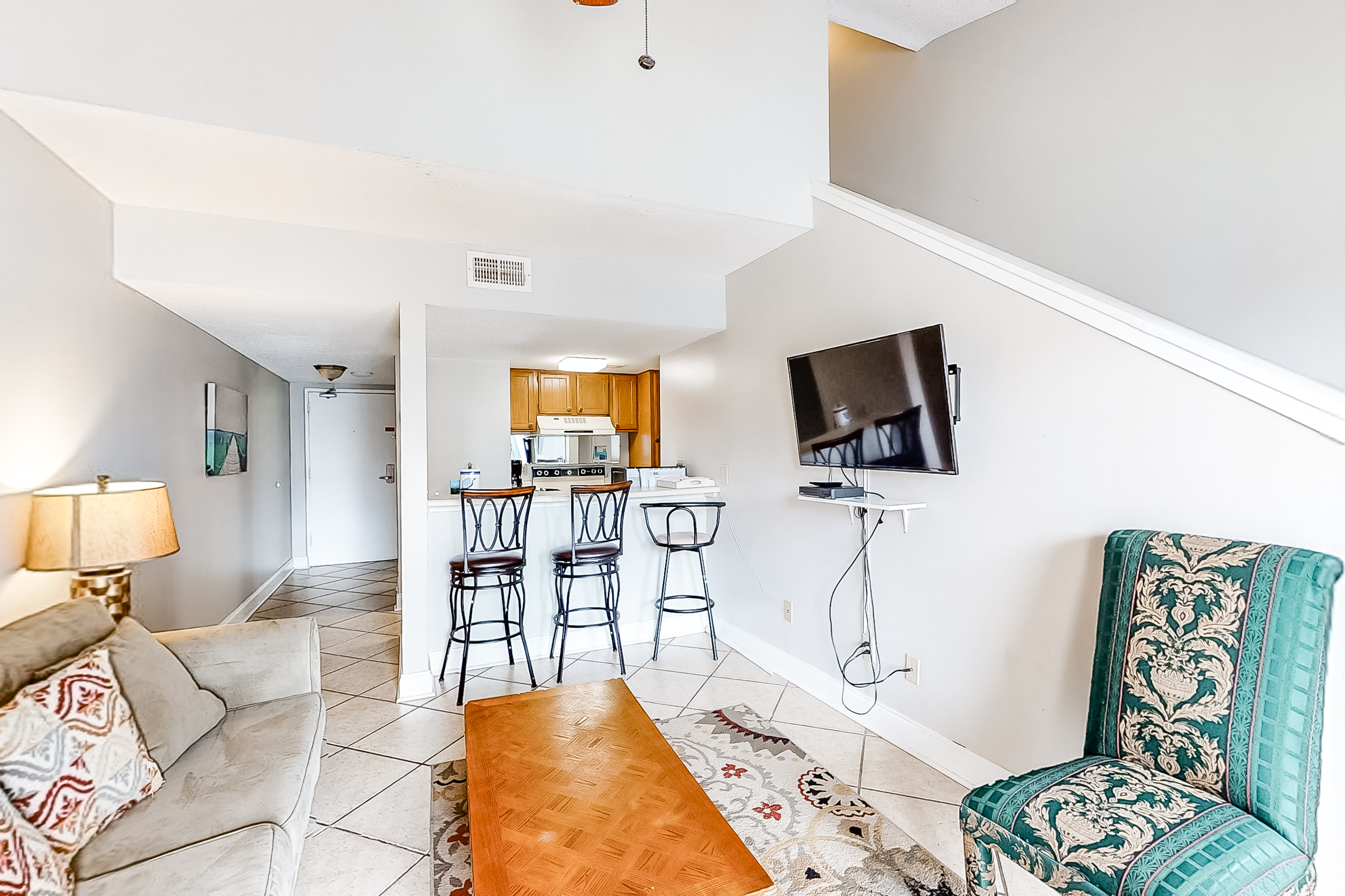 Bright resort condo with pool access, cozy patio, plus a washer/dryer