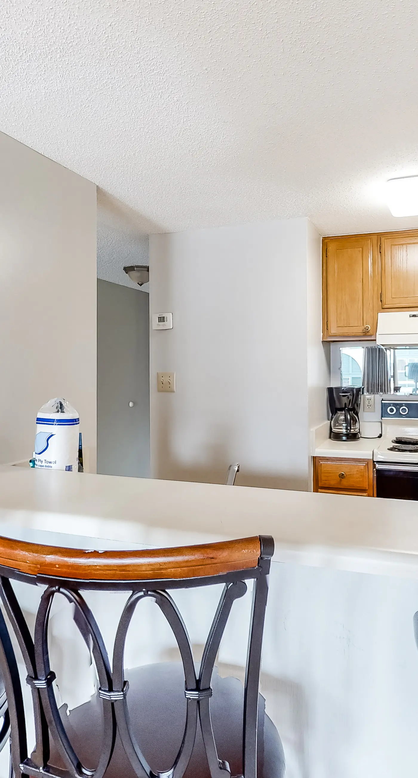 Bright resort condo with pool access, cozy patio, plus a washer/dryer