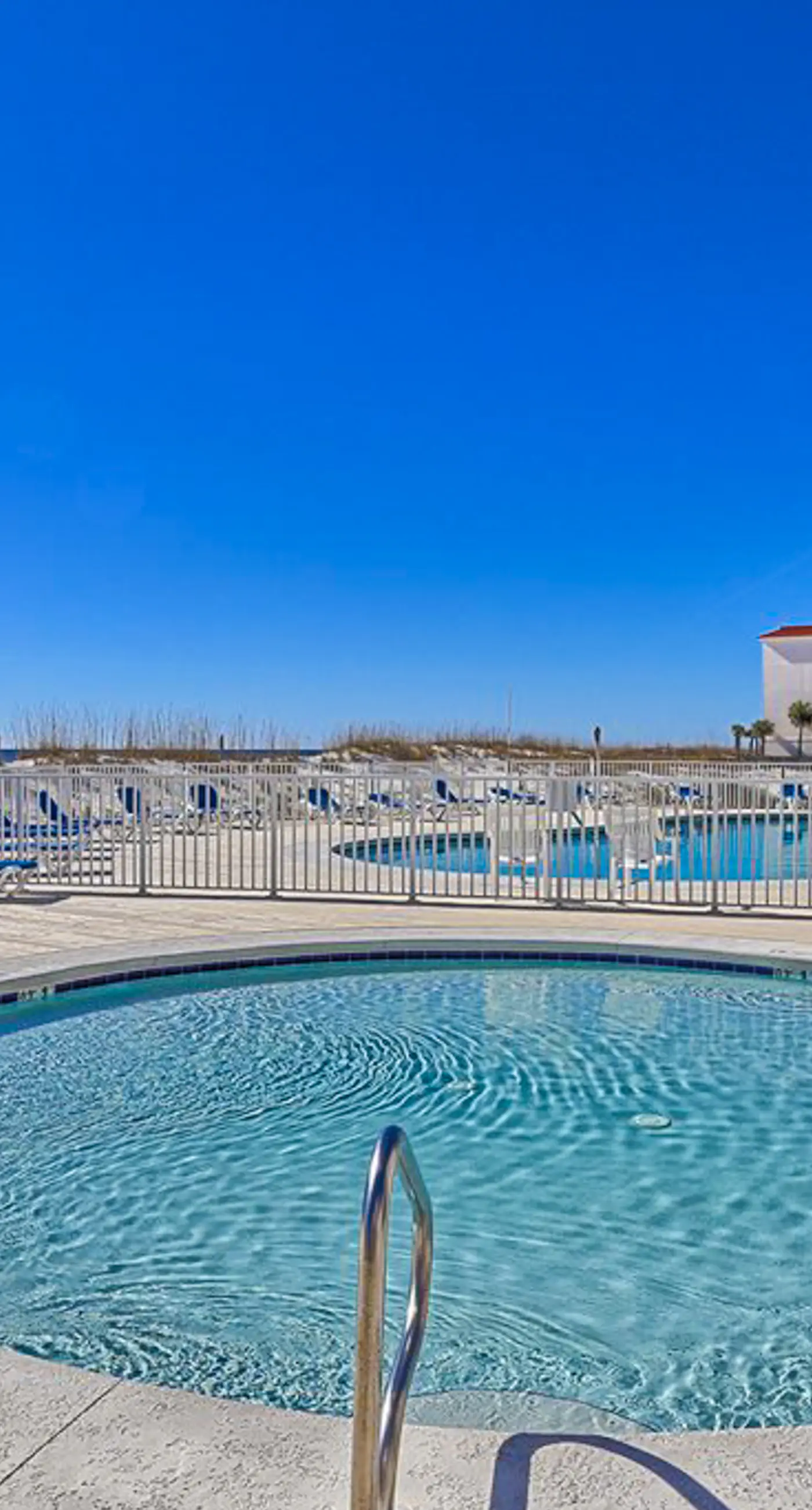 Bright resort condo with pool access, cozy patio, plus a washer/dryer