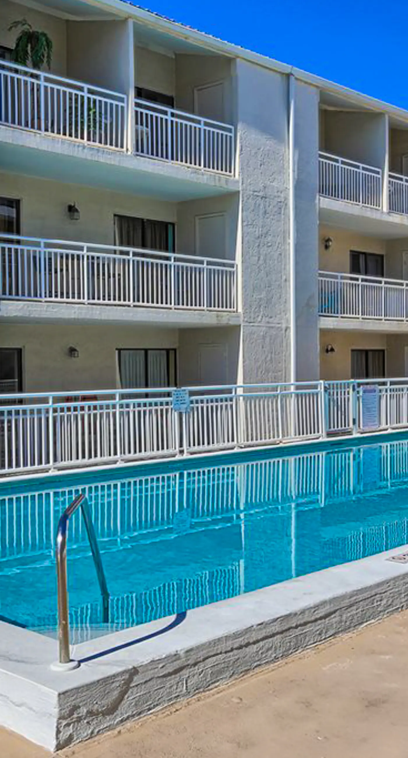 Bright resort condo with pool access, cozy patio, plus a washer/dryer