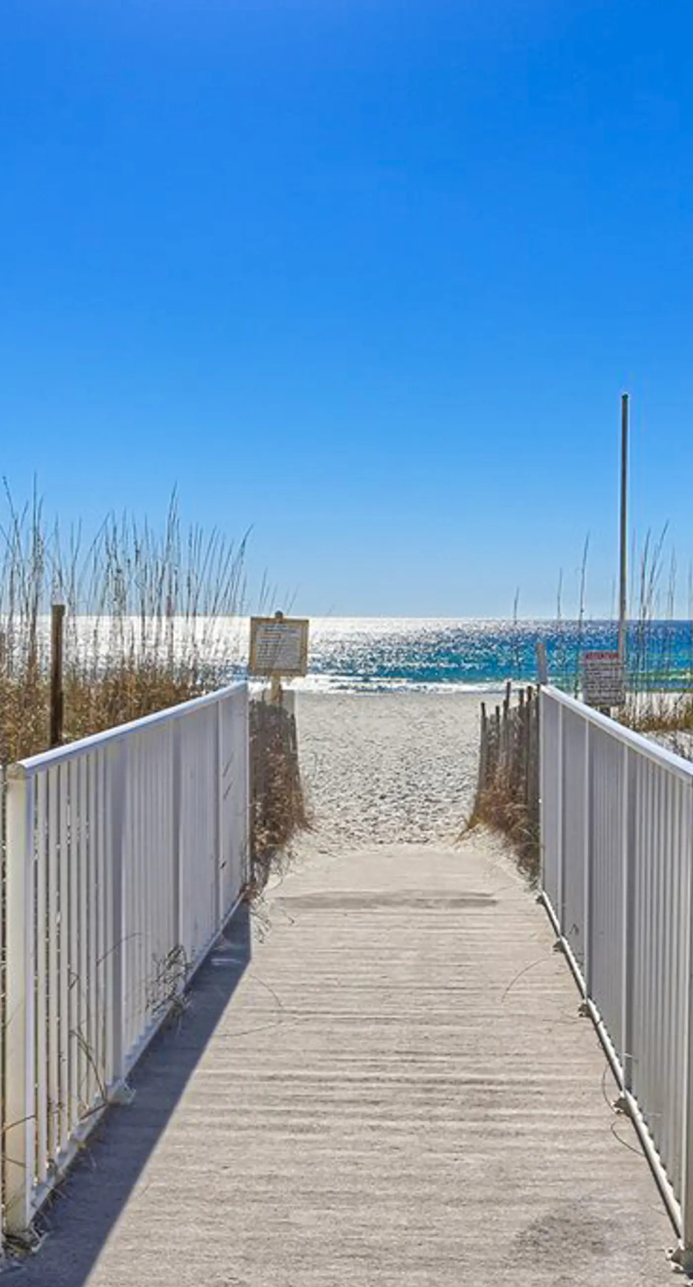 Bright resort condo with pool access, cozy patio, plus a washer/dryer