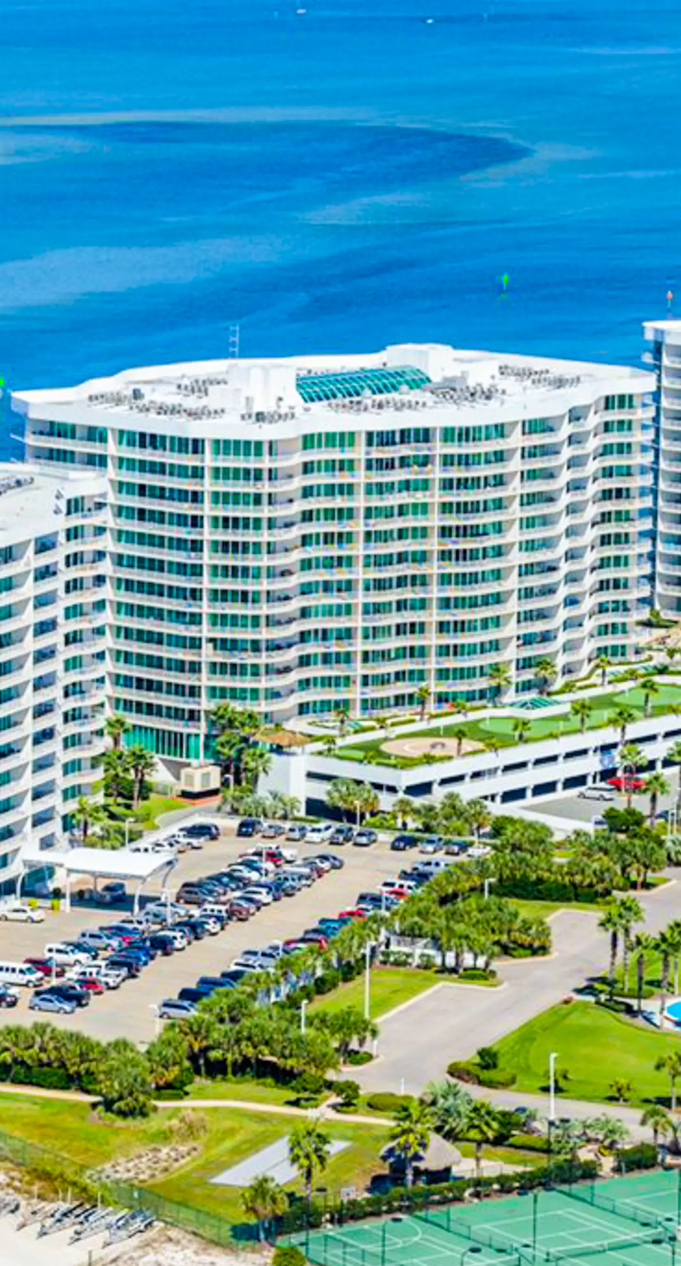 Beachfront 13th-floor condo with balcony, hot tubs, pools, & tennis courts