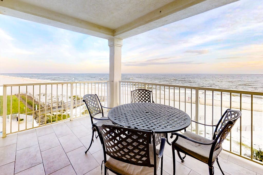Gulf-Front condo with balcony, beach access, WiFi, AC, & outdoor pool