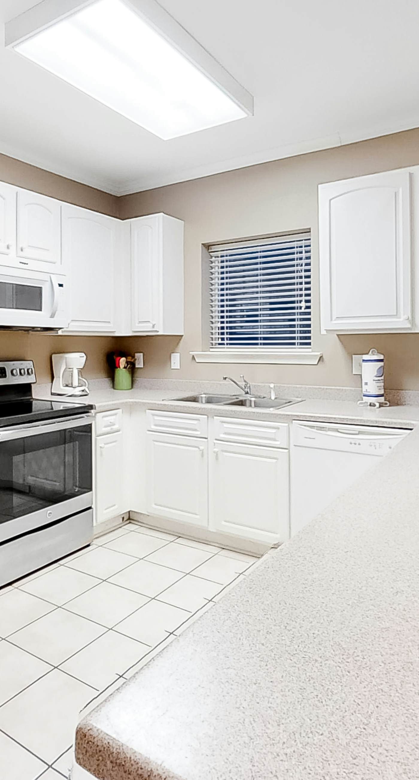 Gulf-Front condo with balcony, beach access, WiFi, AC, & outdoor pool