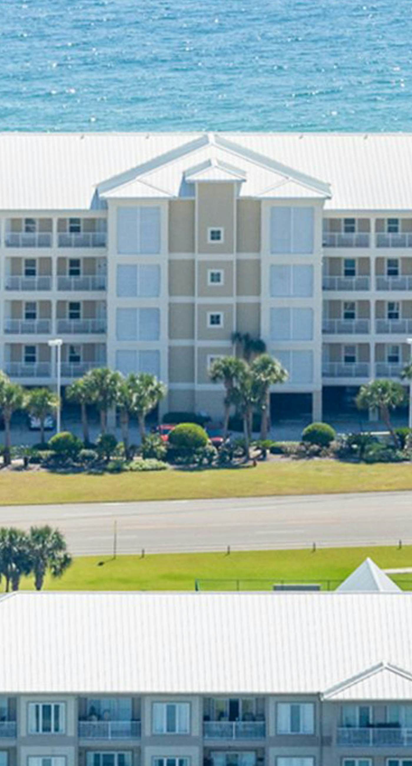 Gulf-Front condo with balcony, beach access, WiFi, AC, & outdoor pool