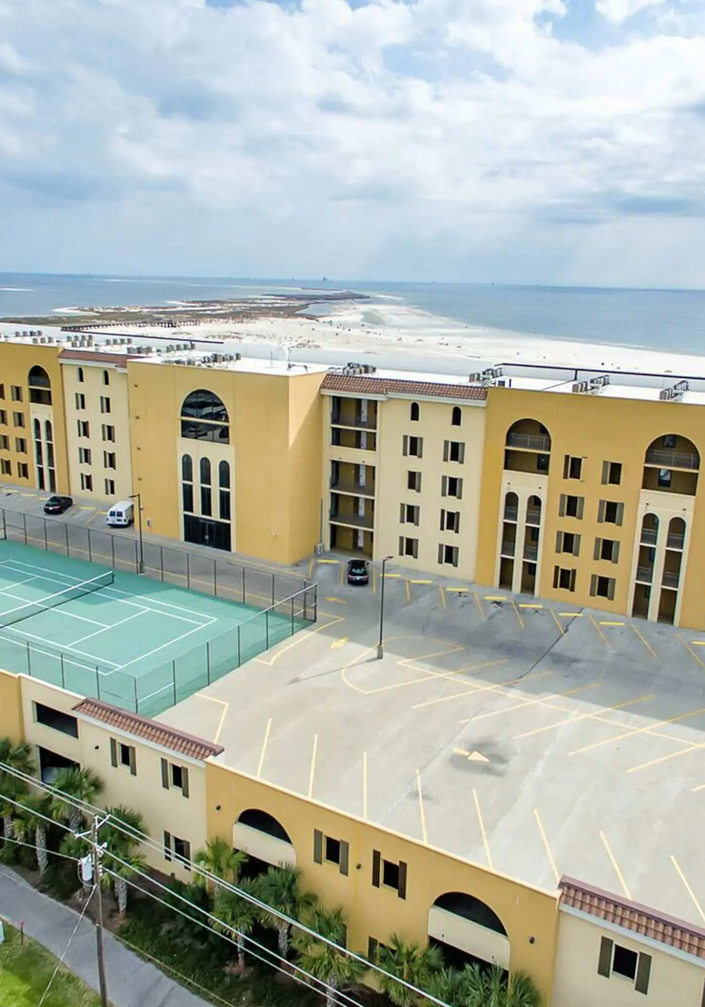 Gulf-front condo with a beach view, pools, hot tub, tennis, & fitness room