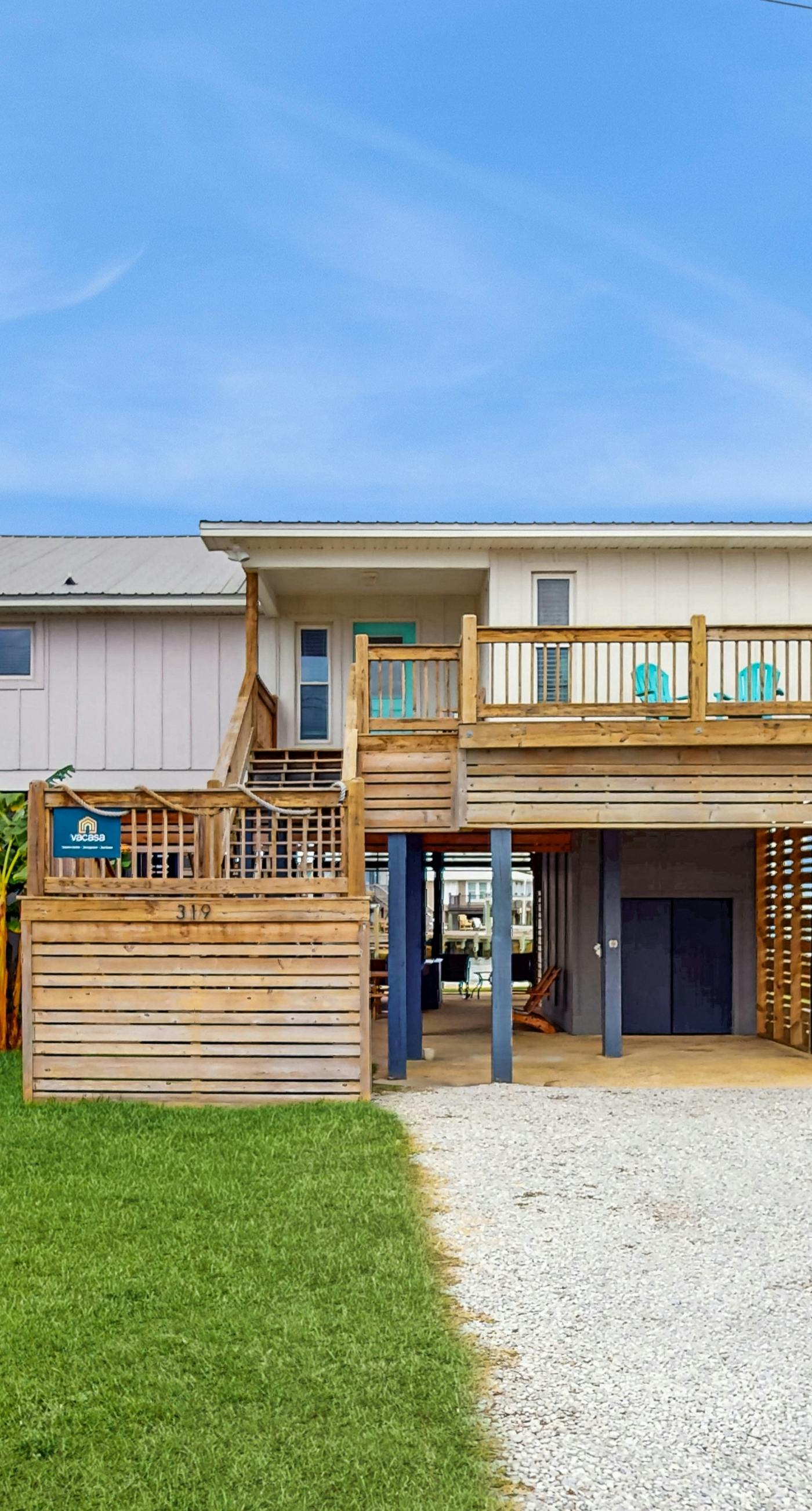 Serene sound-front home with a covered patio, dock, and swing bed