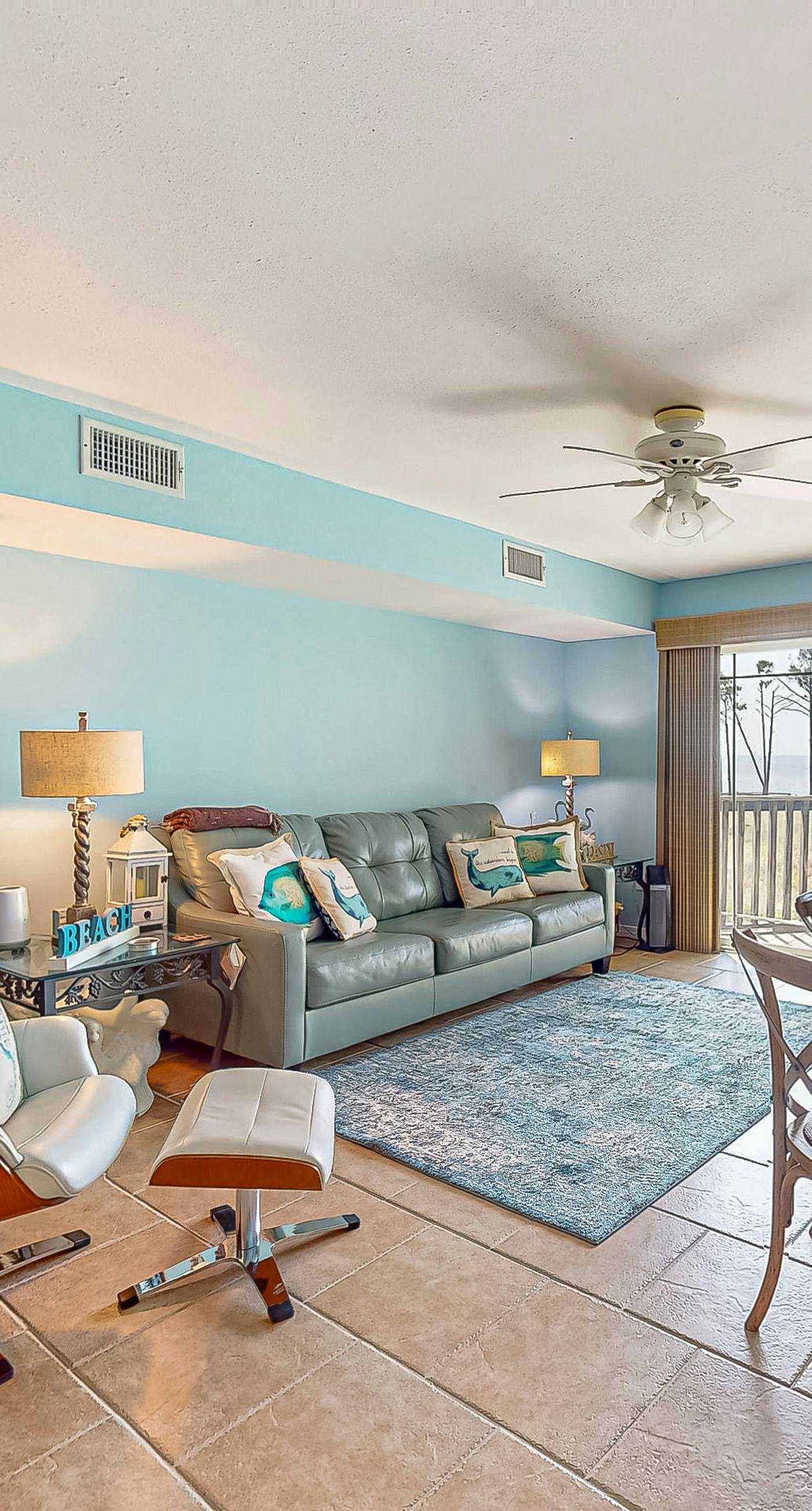 Beachfront 2-story condo with beach views, 2 pools, gazebo, balconies, W/D, & AC