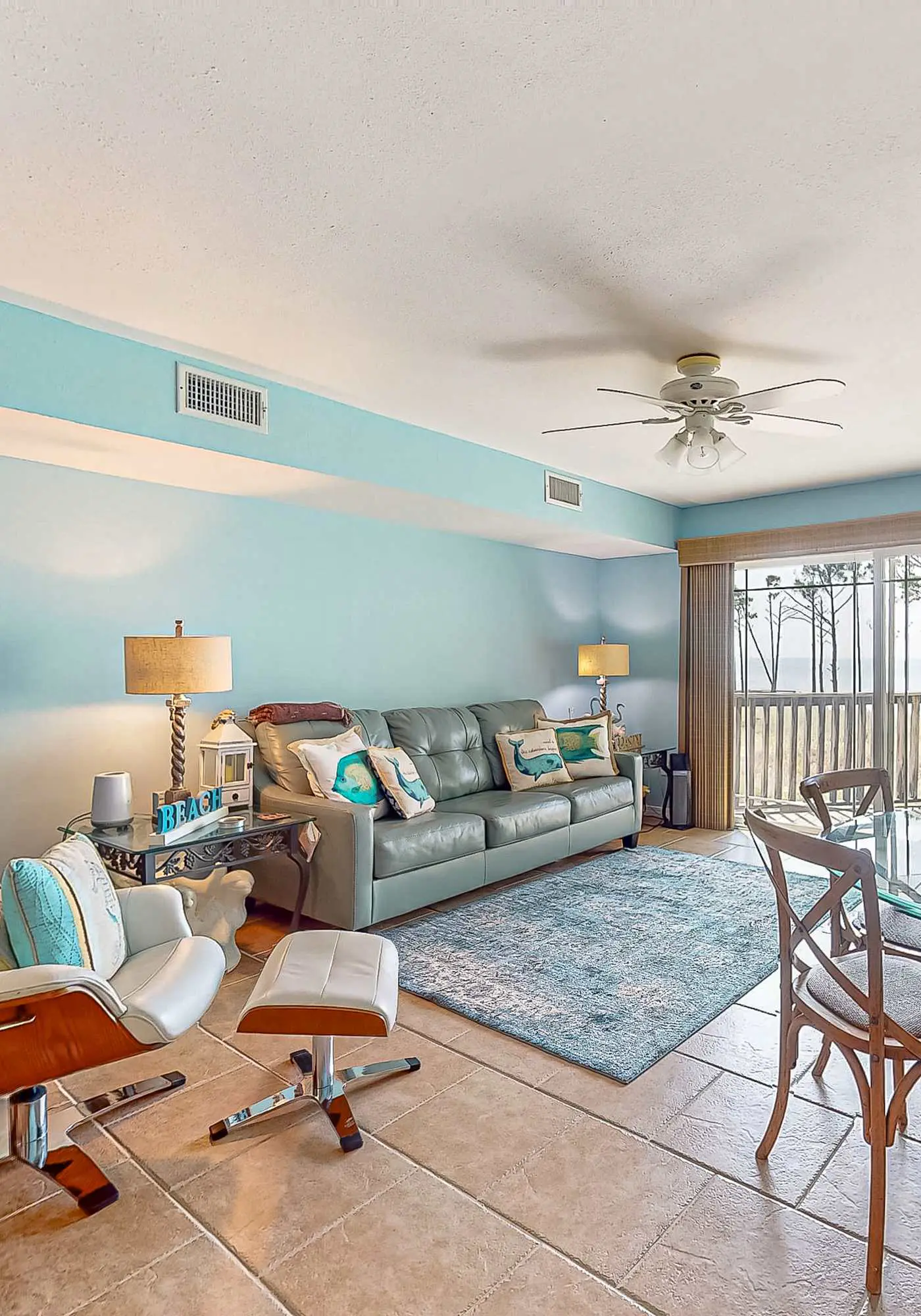 Beachfront 2-story condo with beach views, 2 pools, gazebo, balconies, W/D, & AC