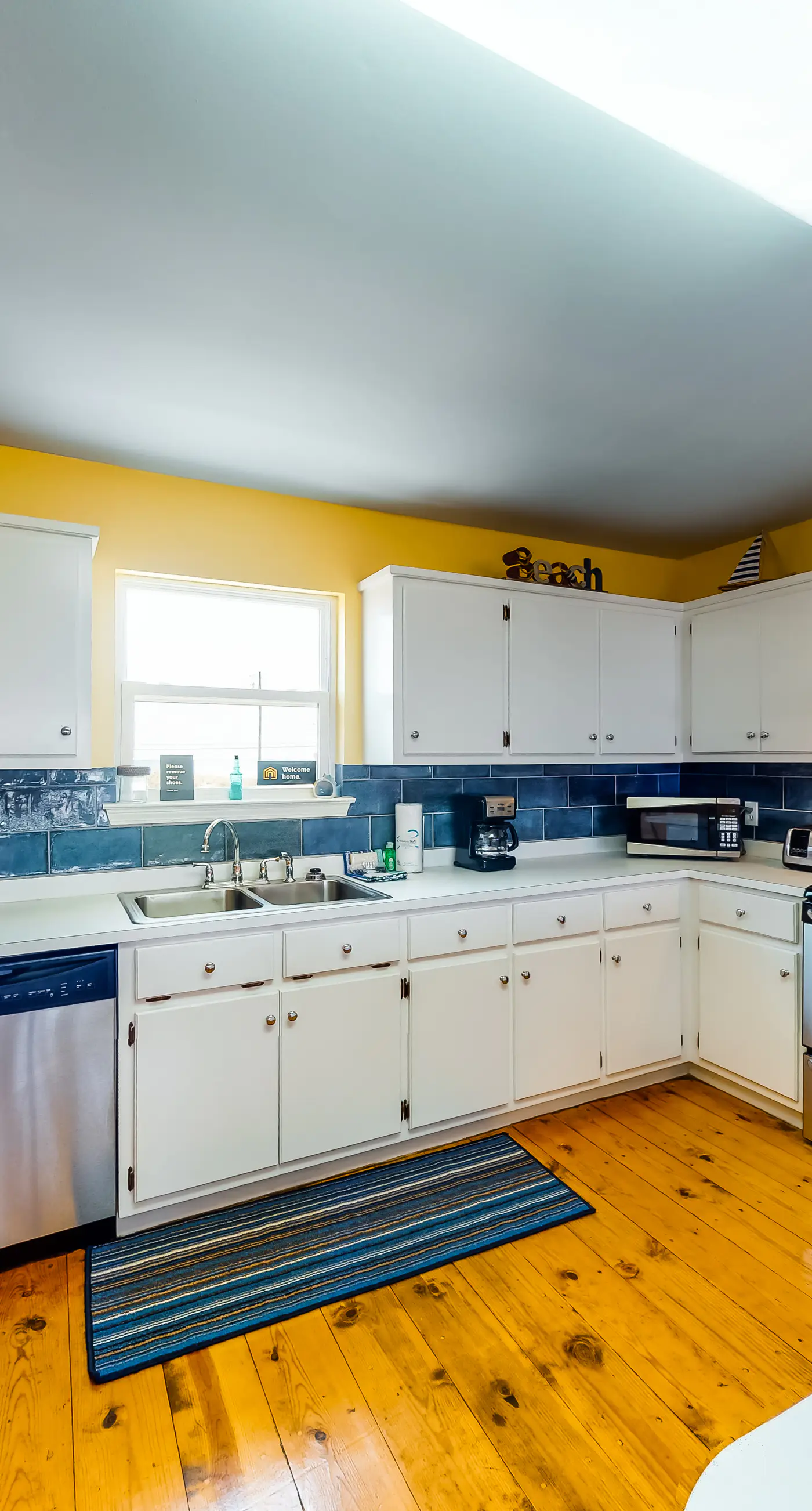 Dog-friendly, water view beach house with a full kitchen, furnished deck, private