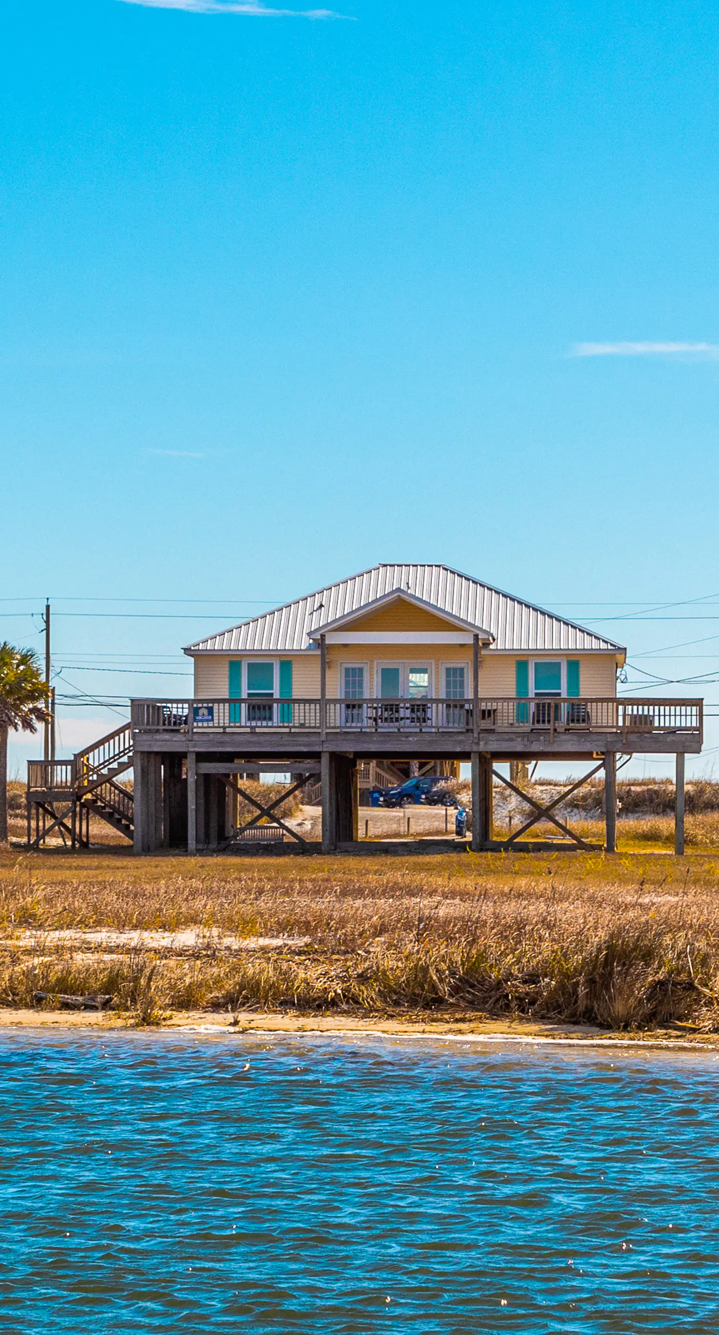 Dog-friendly, water view beach house with a full kitchen, furnished deck, private