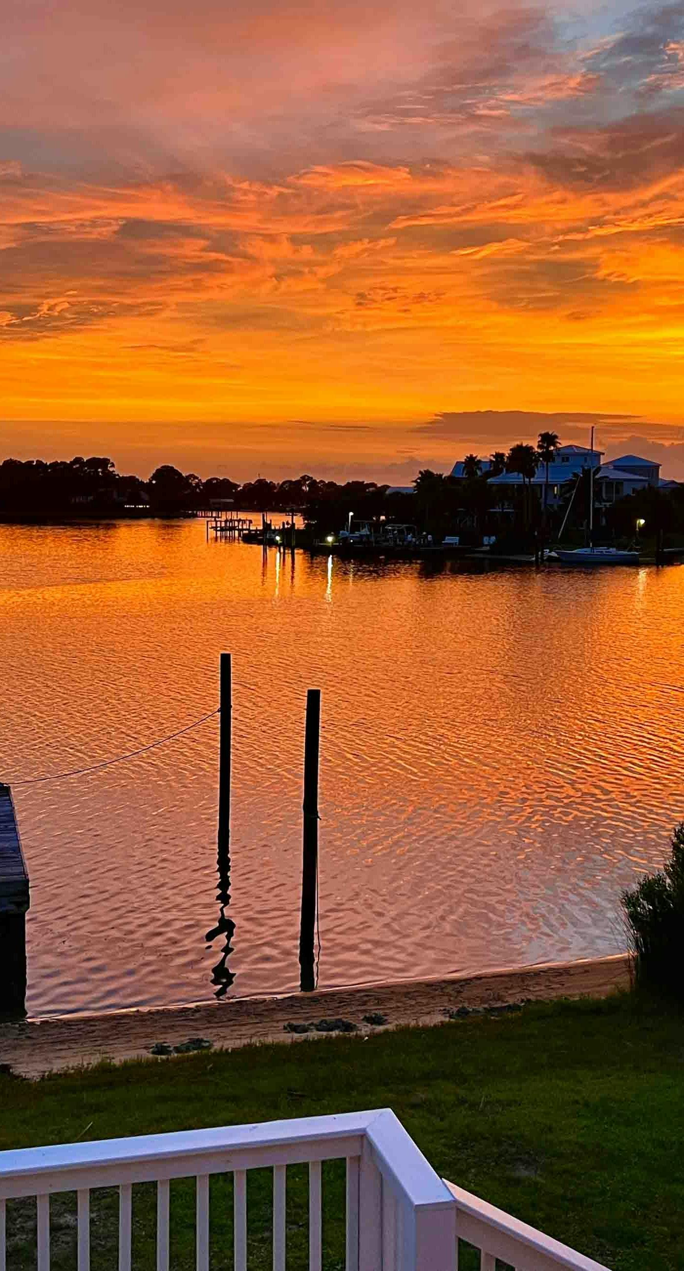 Inviting waterfront home with balcony, full kitchen, central AC, & W/D