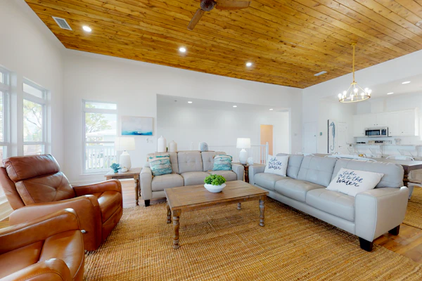 Inviting waterfront home with balcony, full kitchen, central AC, & W/D