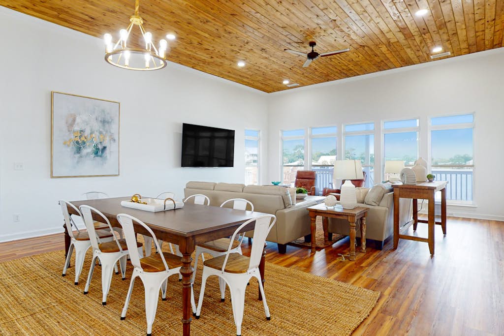 Inviting waterfront home with balcony, full kitchen, central AC, & W/D