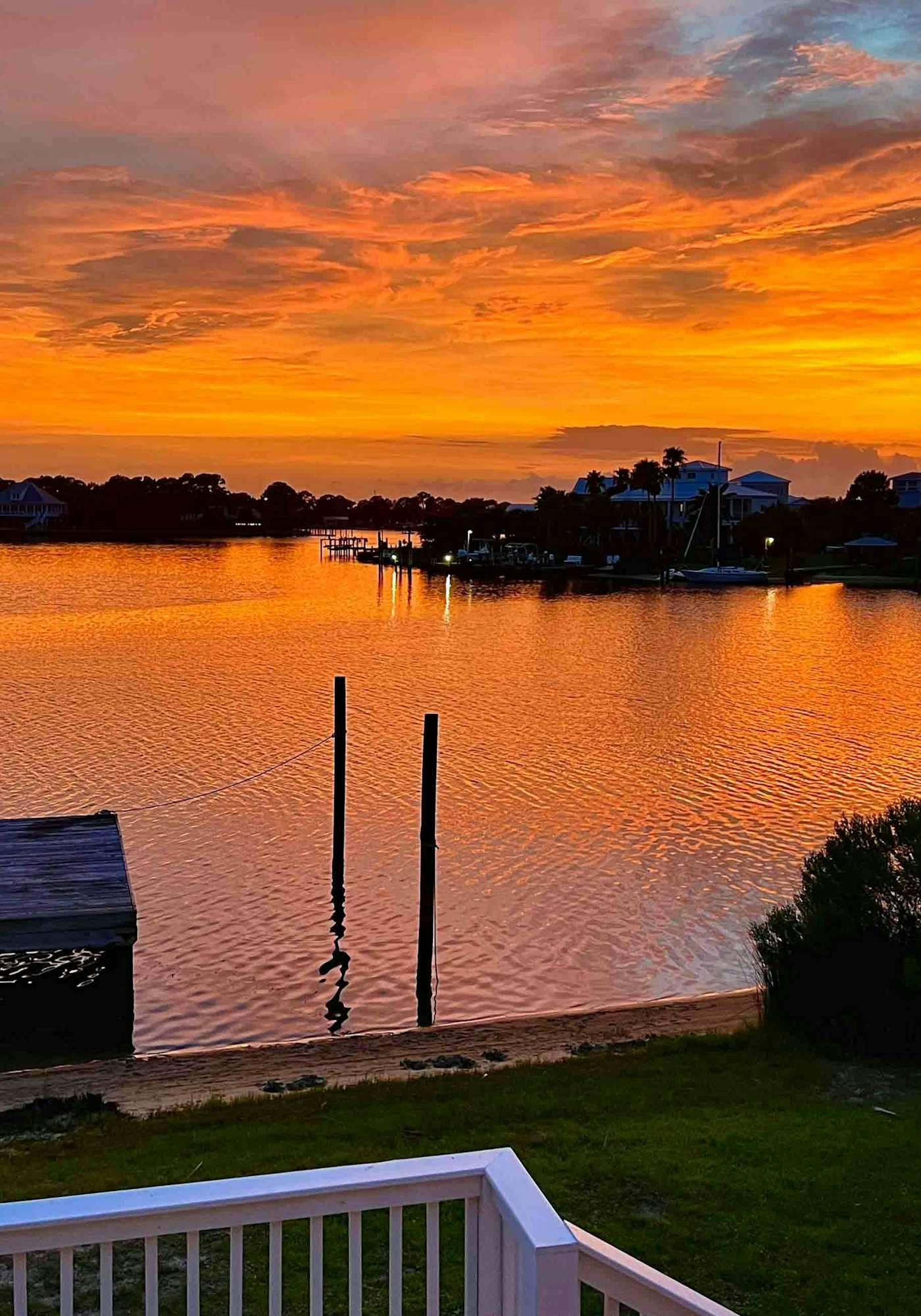 Inviting waterfront home with balcony, full kitchen, central AC, & W/D