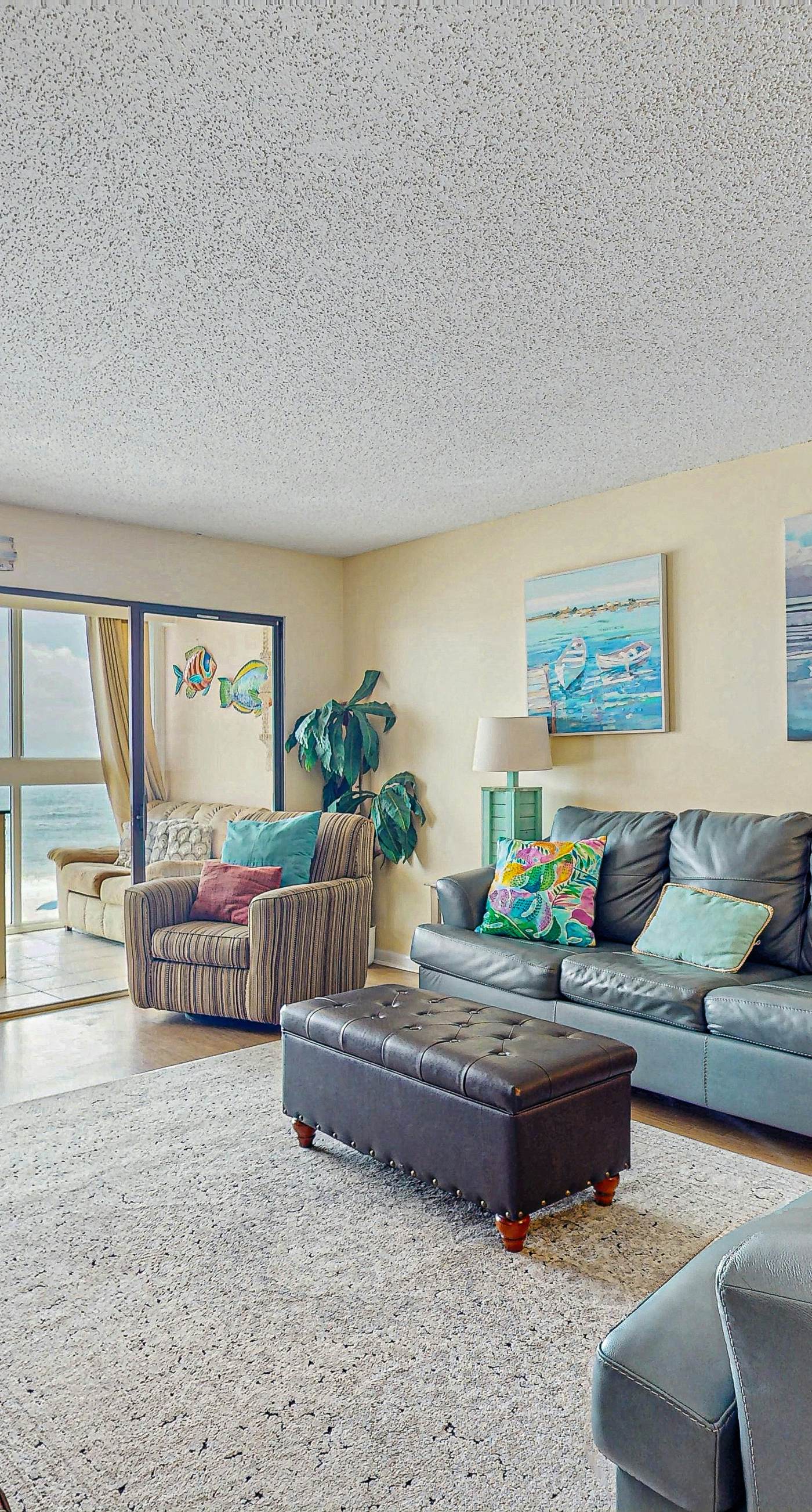 Beachfront condo with enclosed balcony, pool, views, central AC, & grill