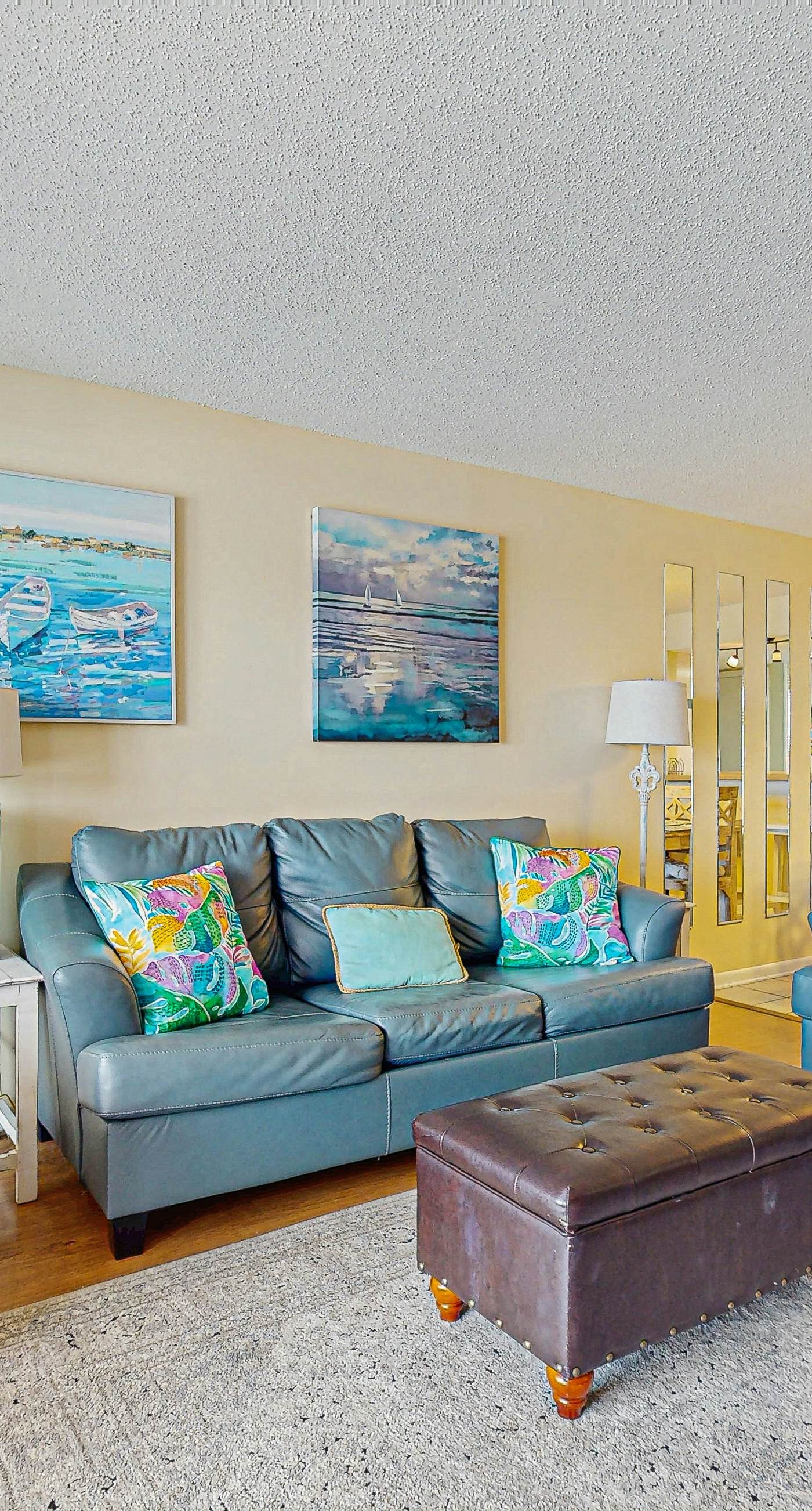 Beachfront condo with enclosed balcony, pool, views, central AC, & grill