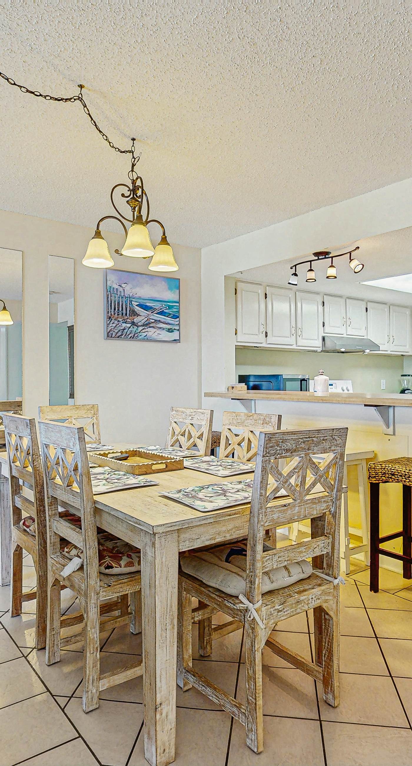 Beachfront condo with enclosed balcony, pool, views, central AC, & grill