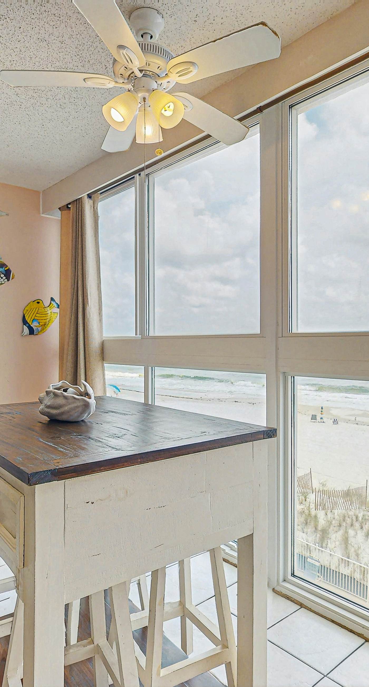 Beachfront condo with enclosed balcony, pool, views, central AC, & grill