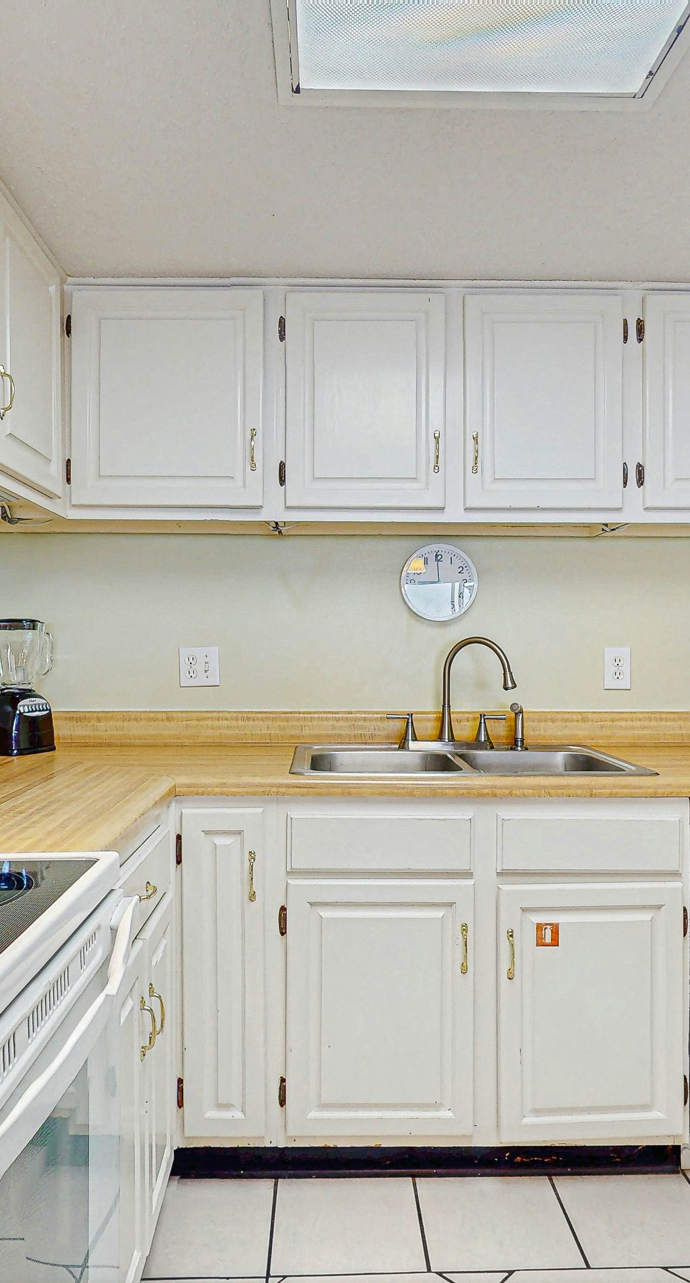 Beachfront condo with enclosed balcony, pool, views, central AC, & grill