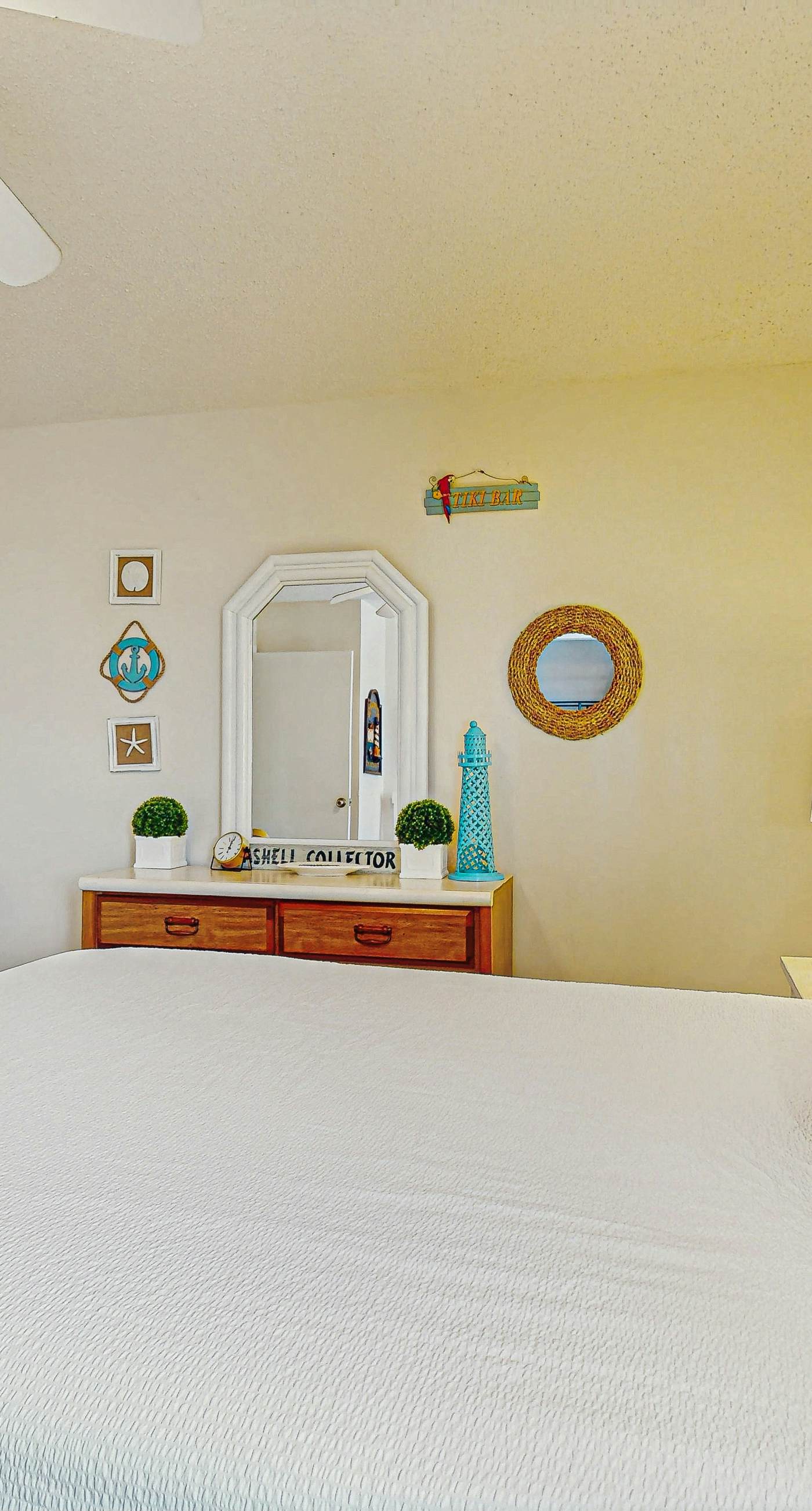 Beachfront condo with enclosed balcony, pool, views, central AC, & grill