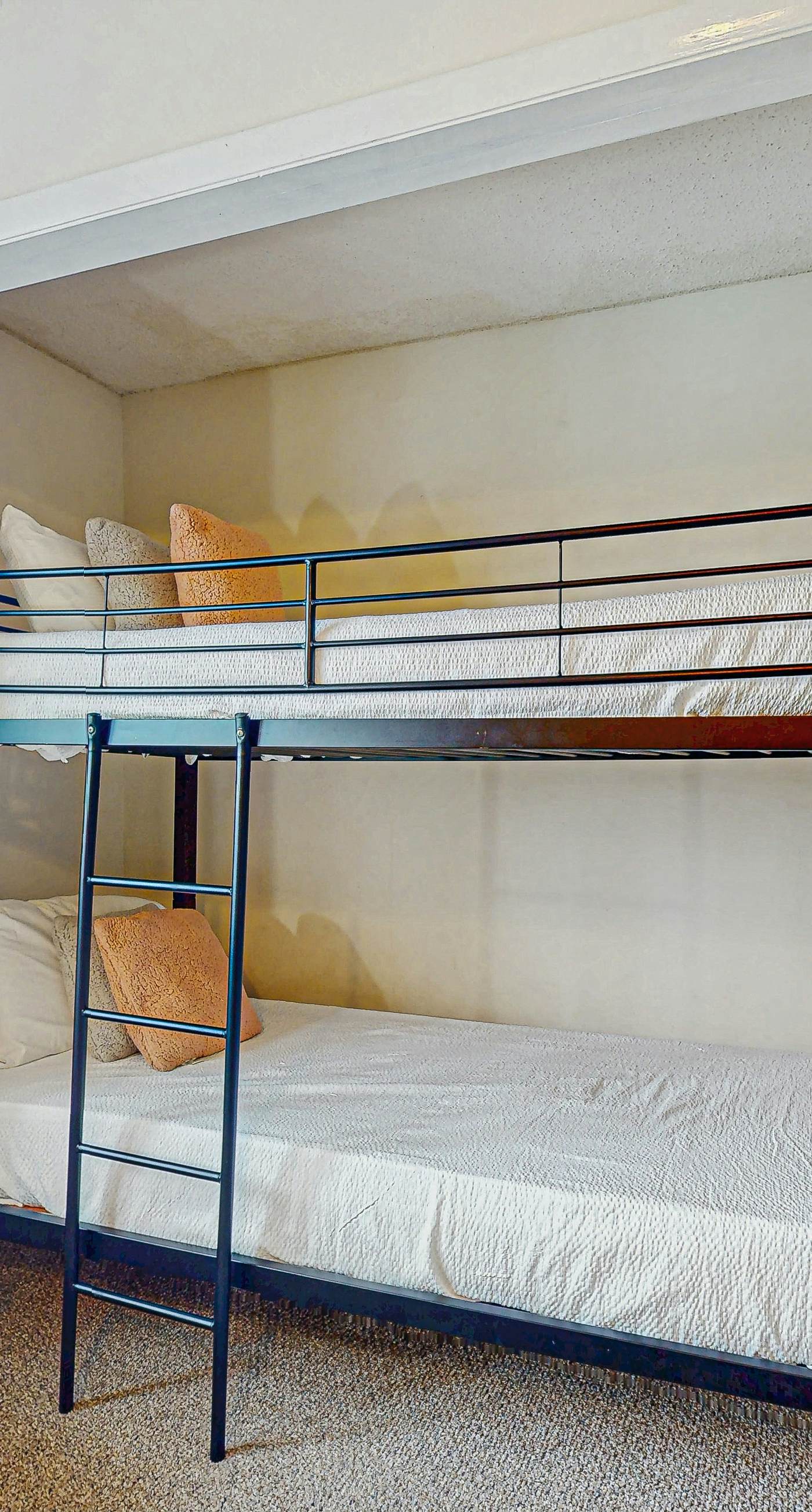 Beachfront condo with enclosed balcony, pool, views, central AC, & grill